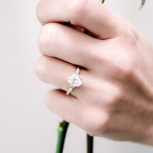 14k rose gold 1.5 carat custom oval lab created diamond engagement ring with cluster marquise and oval side stones ada diamonds design ad 180