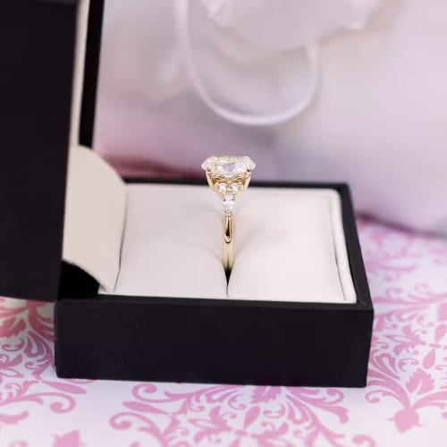 custom oval lab diamond engagement ring with marquise and round side stones in yellow gold ada diamonds design ad180