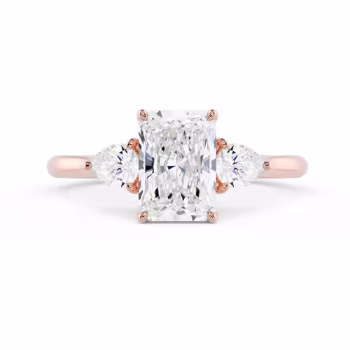 High Quality Synthetic Diamonds set in Rose Gold Radiant and Pear Setting (Main View)