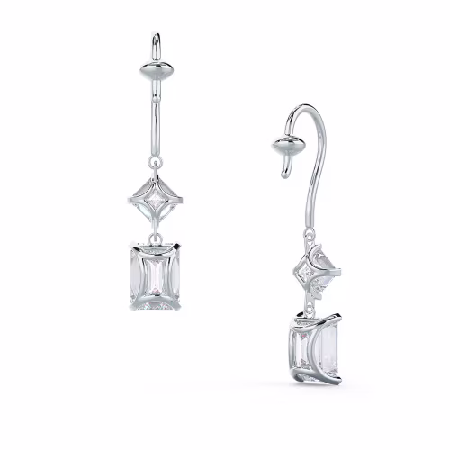 Profile view of platinum drop earrings with emerald and Asscher-cut diamonds on a white background.