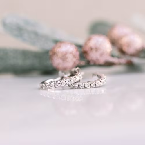 0.63 ct Round Brilliant Diamonds set in 14k White Gold Diamond J Huggie Hoop Earrings (Side View)