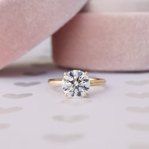 Round Classic Four Prong Solitaire Diamond Engagement Ring in Yellow Gold