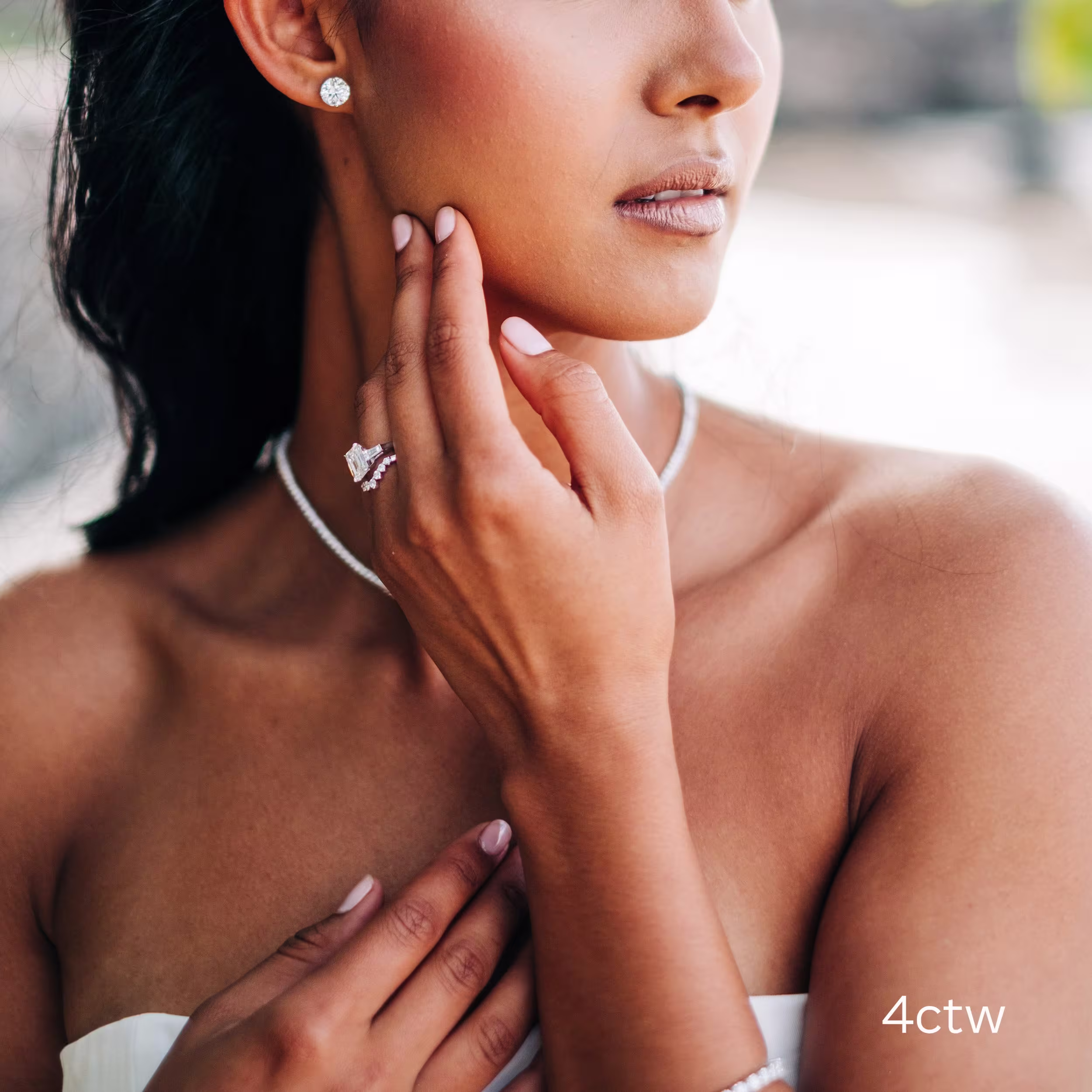 4 ctw four prong round stud earrings in white gold made with lab grown diamonds ADA Diamonds ad 001 on model