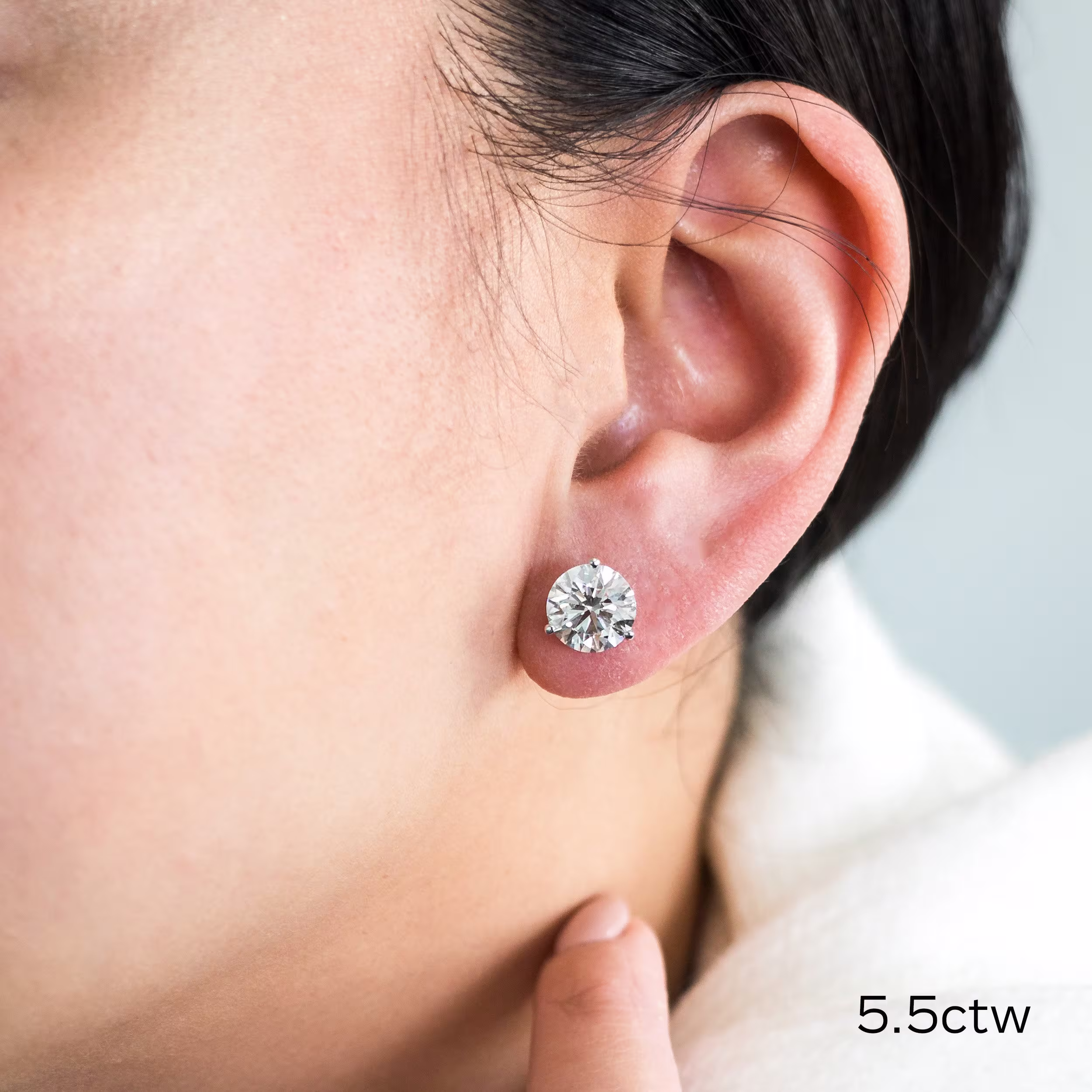 5.5 carat three prong lab diamond studs in 14k white gold