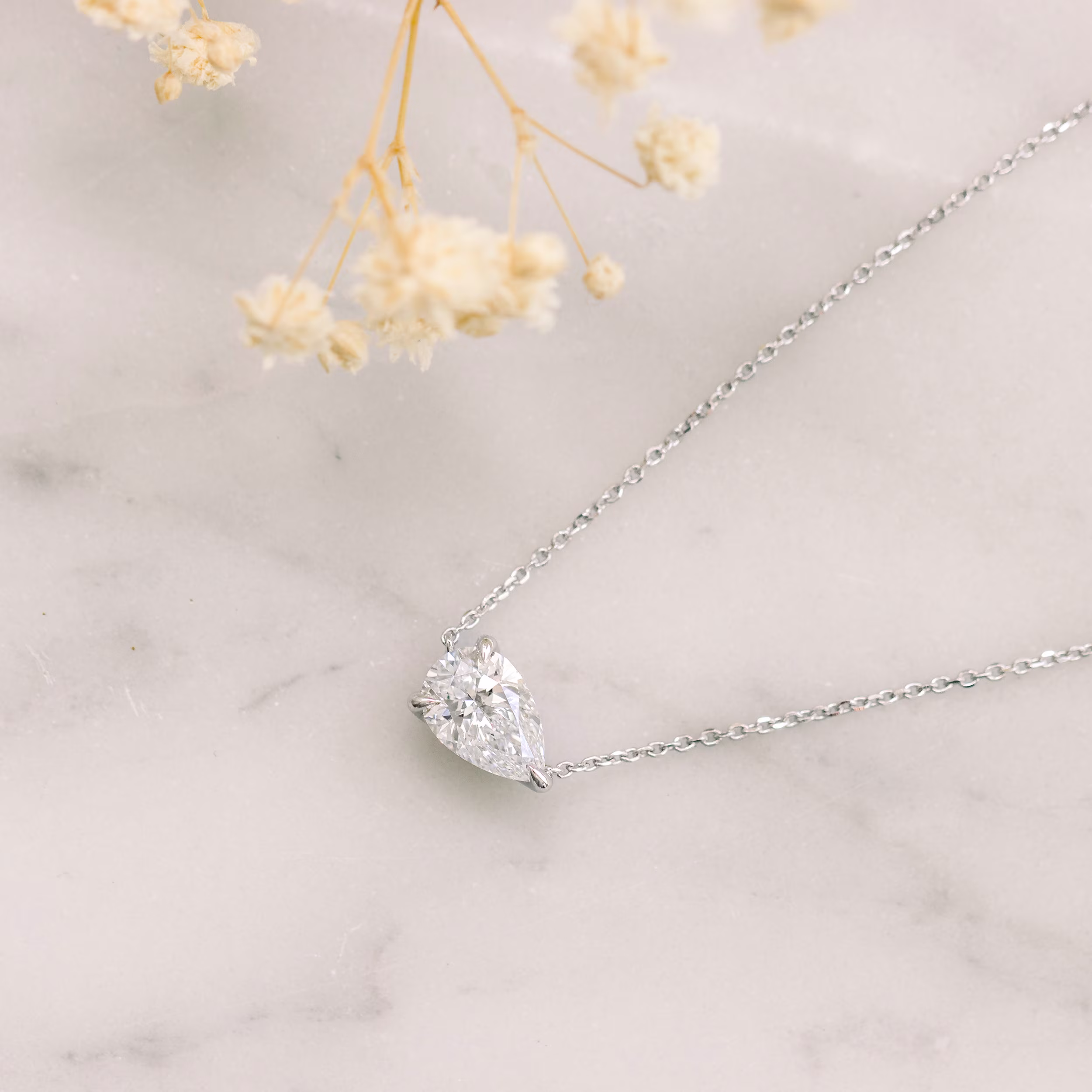 High Quality 1.0 Carat Lab Diamonds set in 14k White Gold Floating Pear Diamond Pendant (Main View)