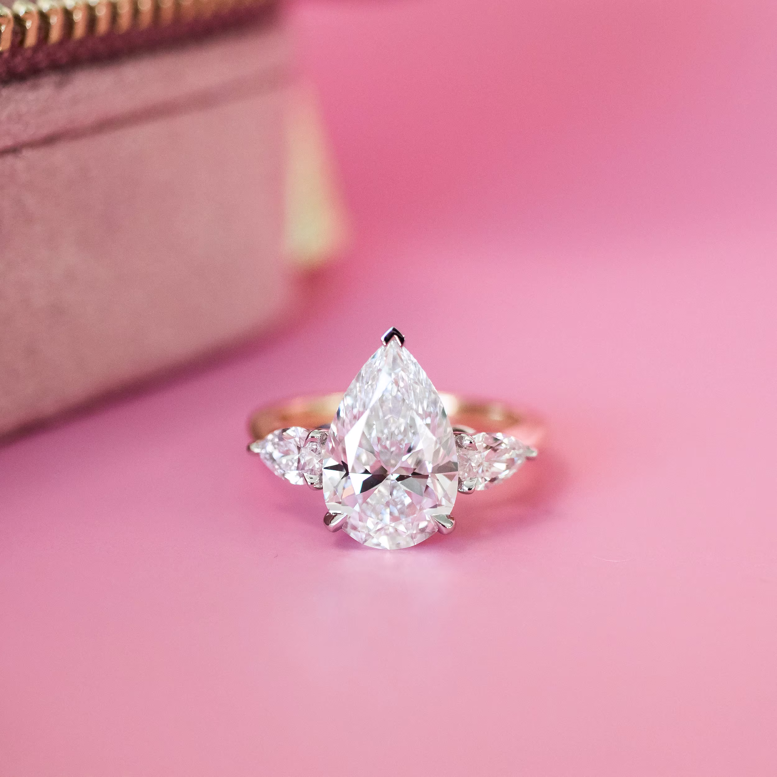 Two tone Yellow gold and platinum Pear Three Stone Diamond Engagement Ring featuring 3.5 Carat Man Made Diamonds (Main View)