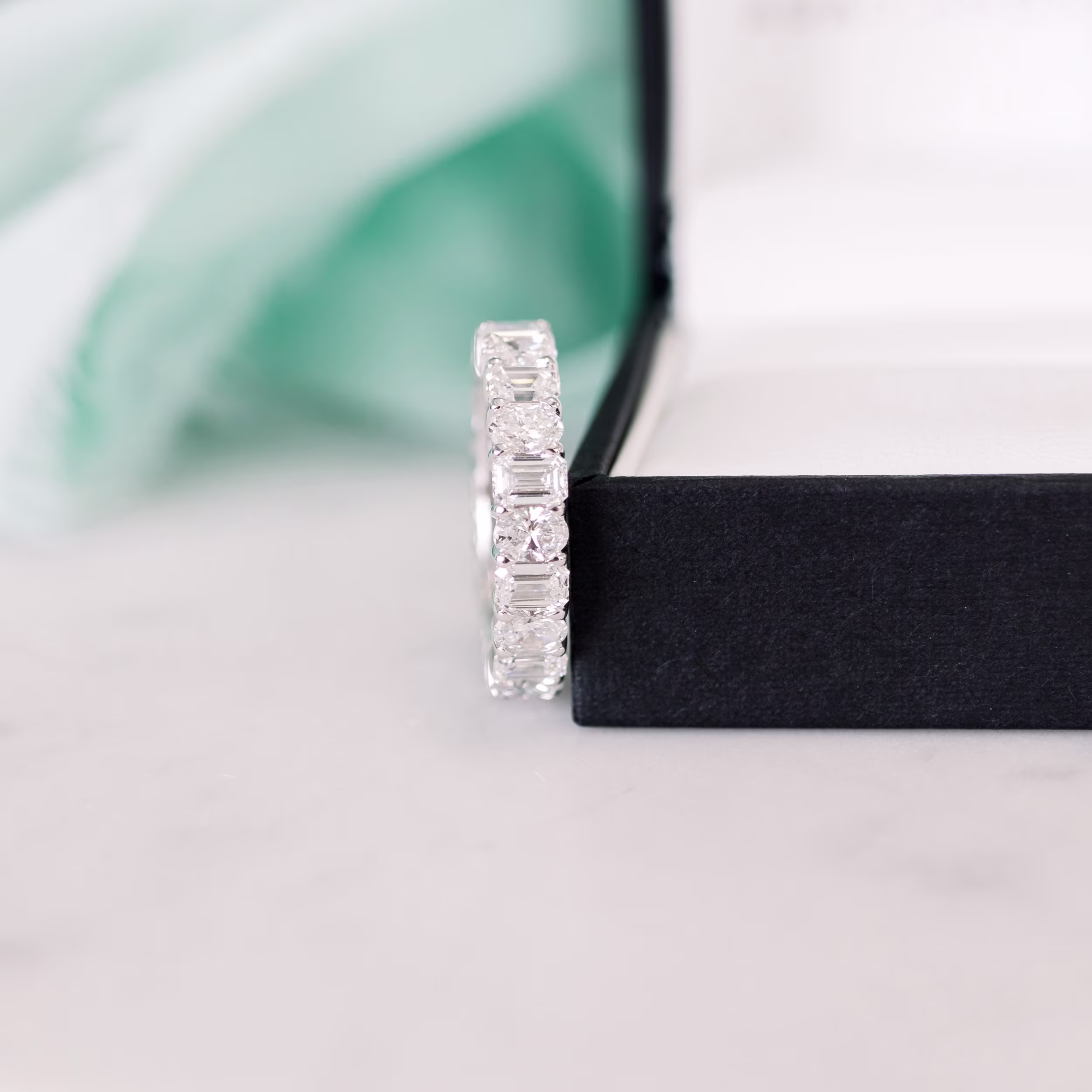 18k White Gold 5.5ctw Emerald and Oval Diamond Eternity Band in 18k White Gold featuring 5.5 Carat Lab Diamonds (Side View)