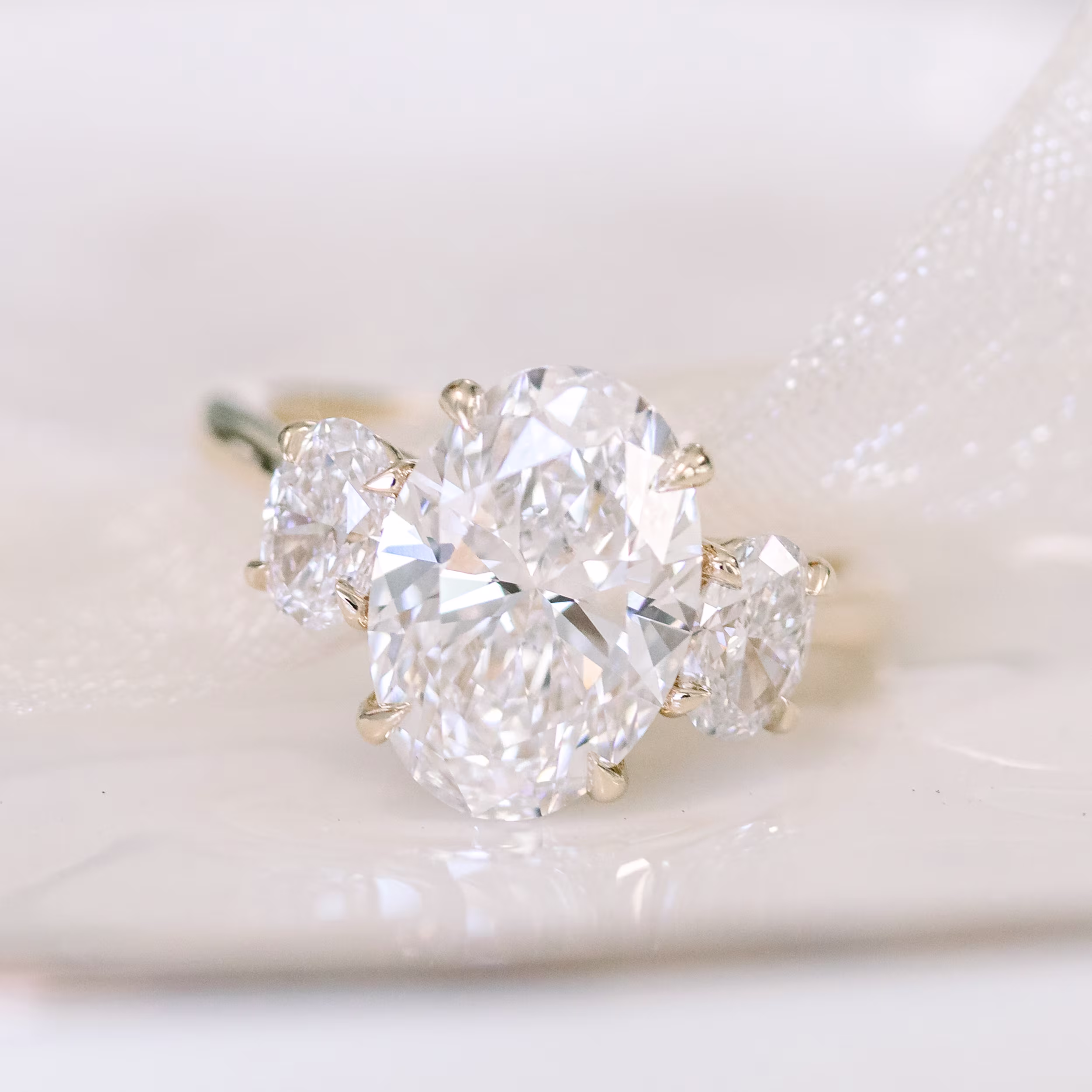 Oval Three Stone Setting featuring High Quality Lab Grown Diamonds (Profile View)
