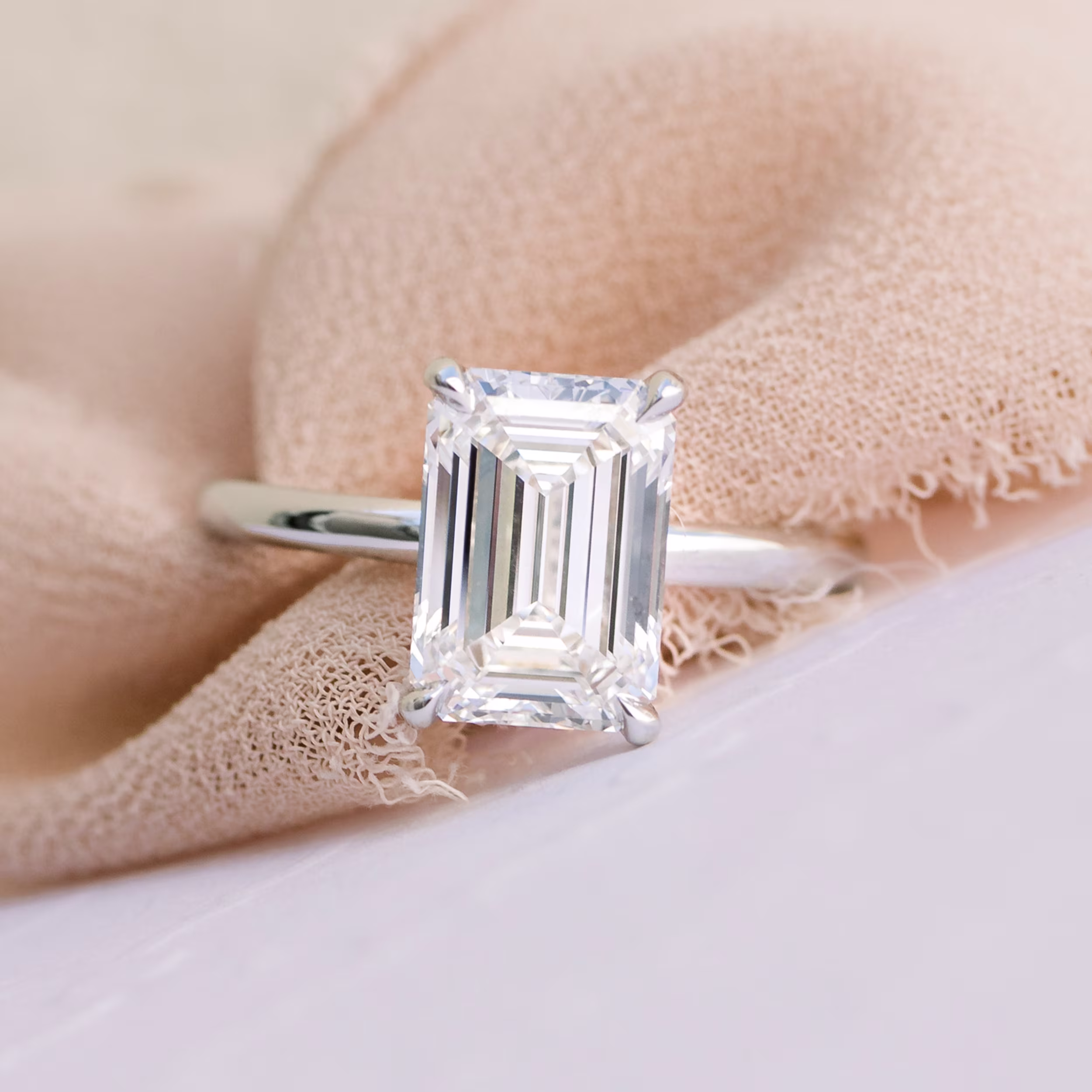 Emerald Petite Four Prong Solitaire featuring Hand Selected Lab Diamonds (Profile View)