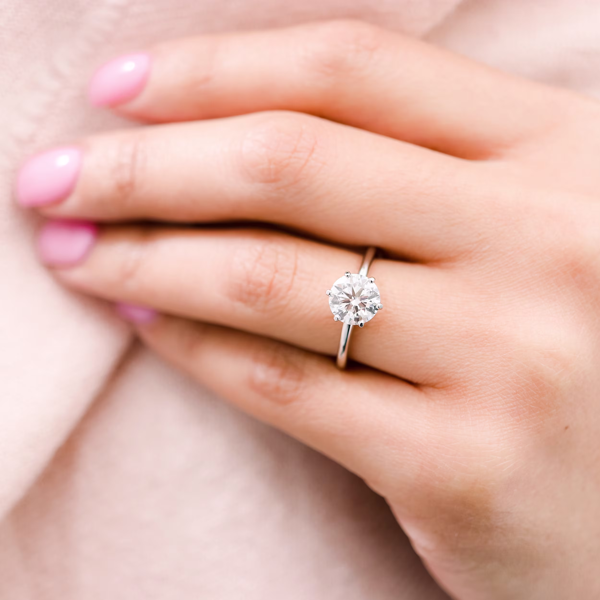 Platinum Round Classic Six Prong Solitaire featuring Hand Selected Diamonds (Profile View)