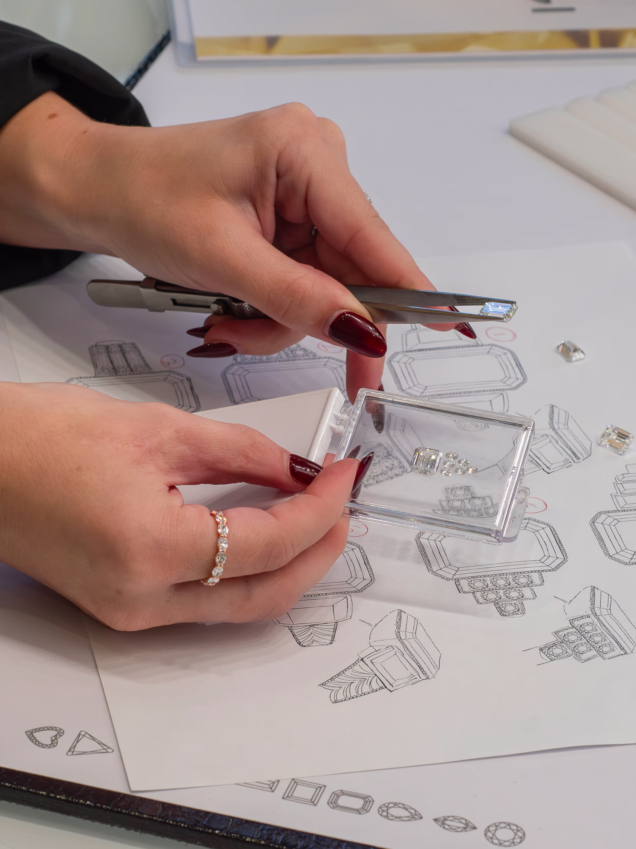 jeweler laying out lab diamonds for custom ring design ada diamonds