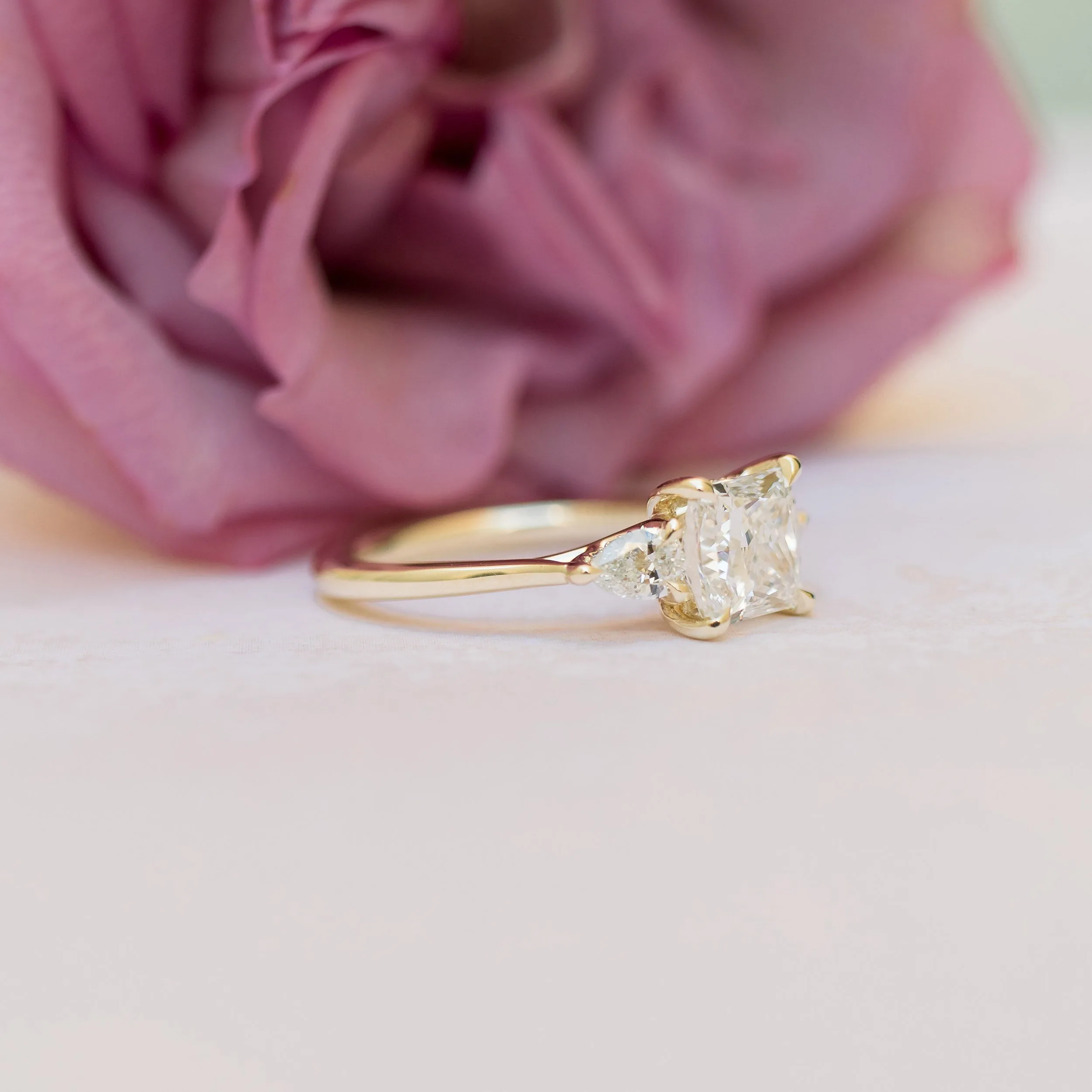 High Quality 1.75 ct Lab Diamonds set in 14k Yellow Gold Princess and Pear Setting (Side View)