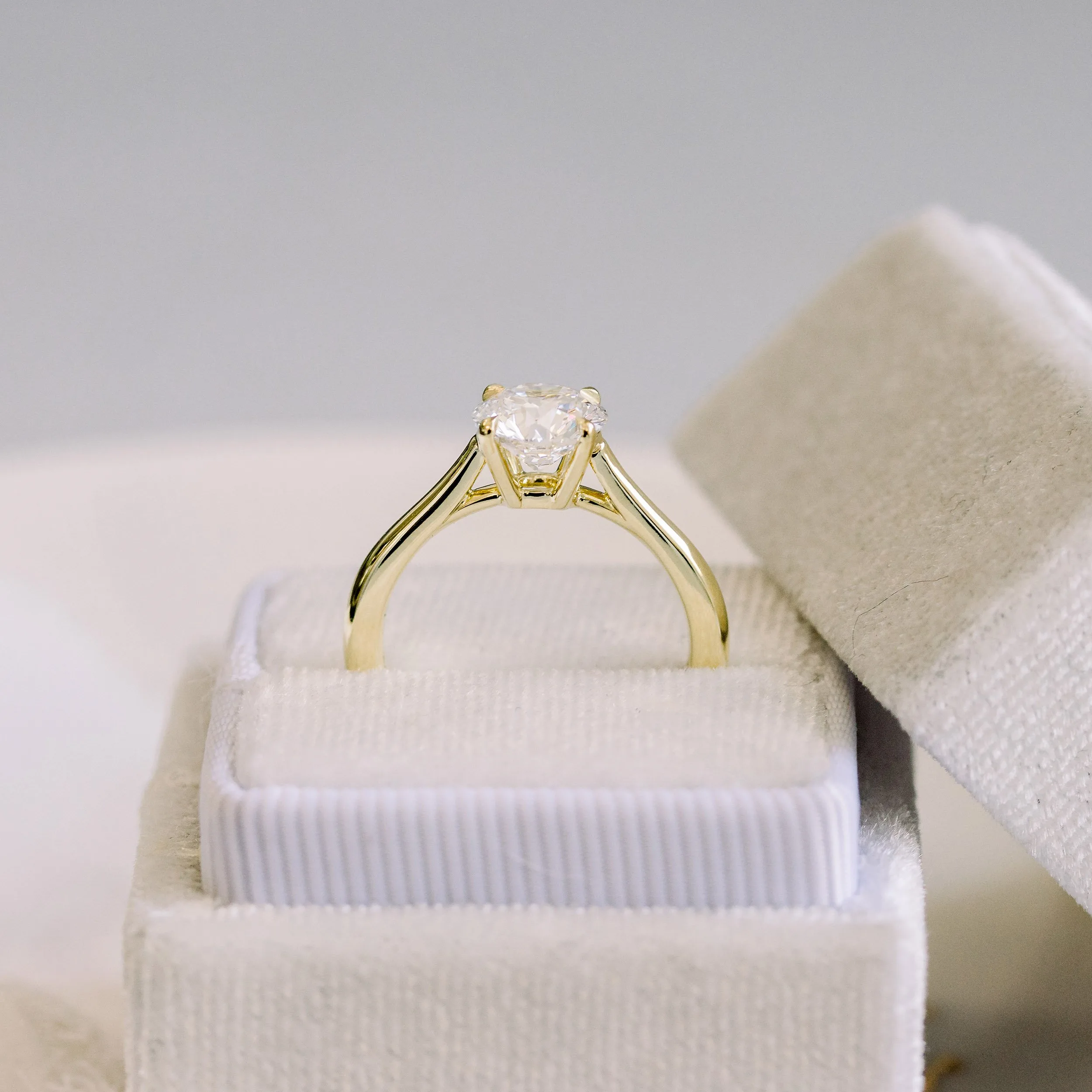 Hand Selected 1.25 Carat Man Made Diamonds set in 18kt Yellow Gold Open Tapered Cathedral Solitaire Diamond Engagement Ring (Profile View)