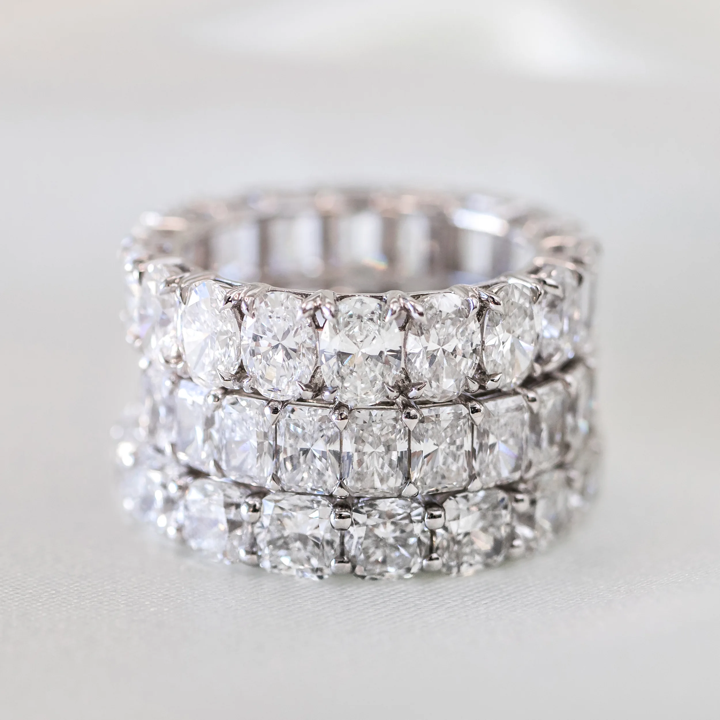 Oval Diamond French U Eternity Band featuring High Quality Synthetic Diamonds