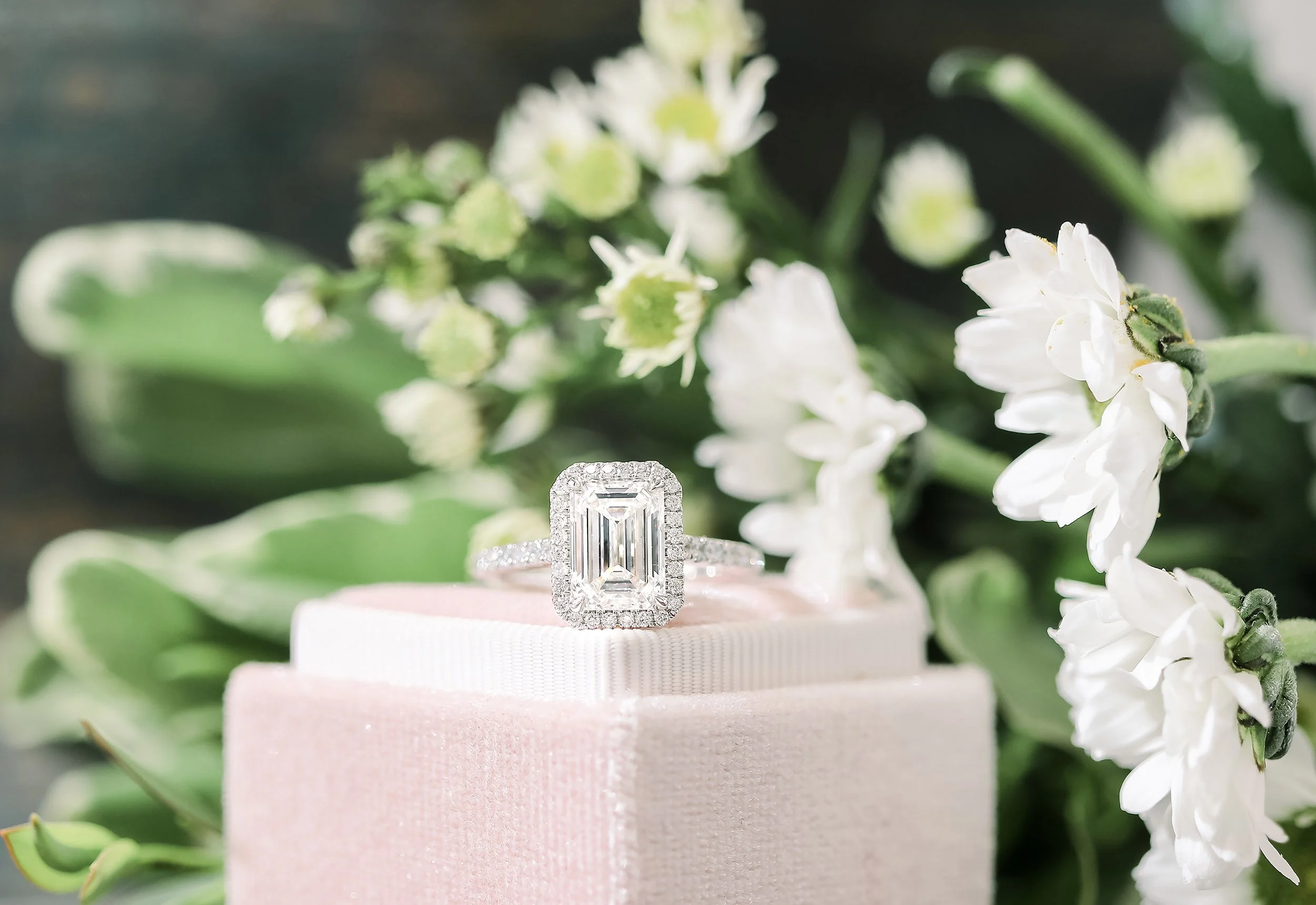 lab created emerald cut diamond in halo setting in platinum