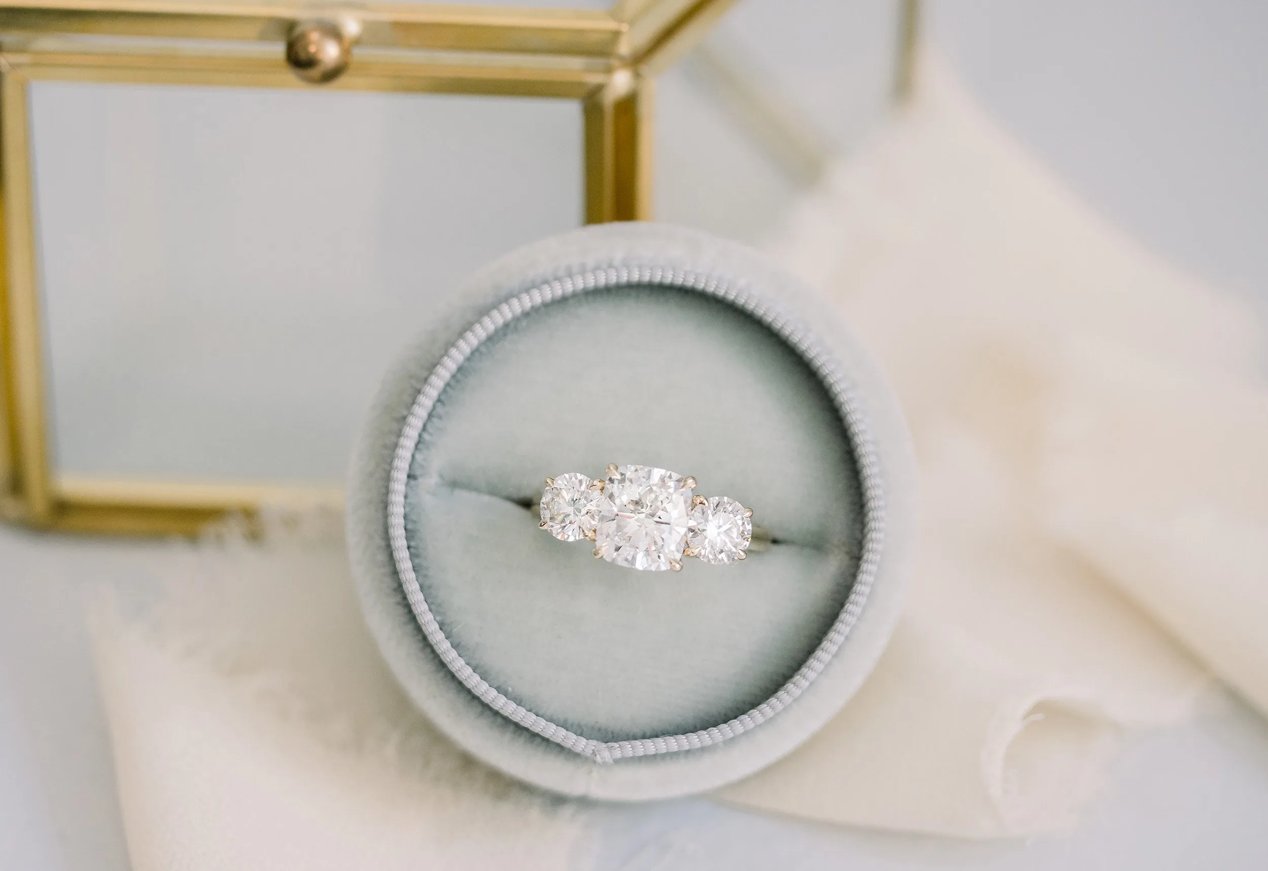 cushion and round three stone lab diamond engagement ring