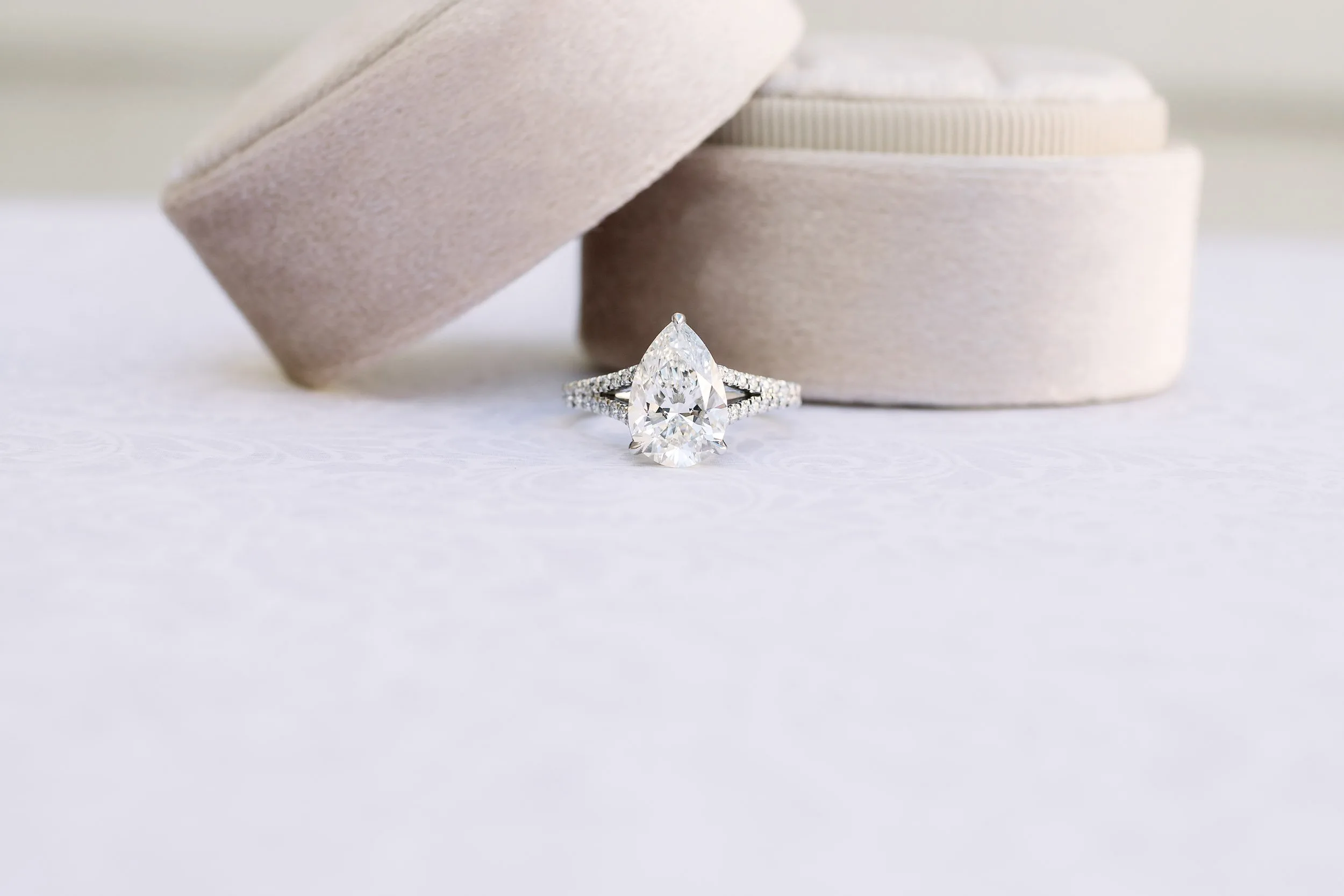 lab created pear diamond in pave setting