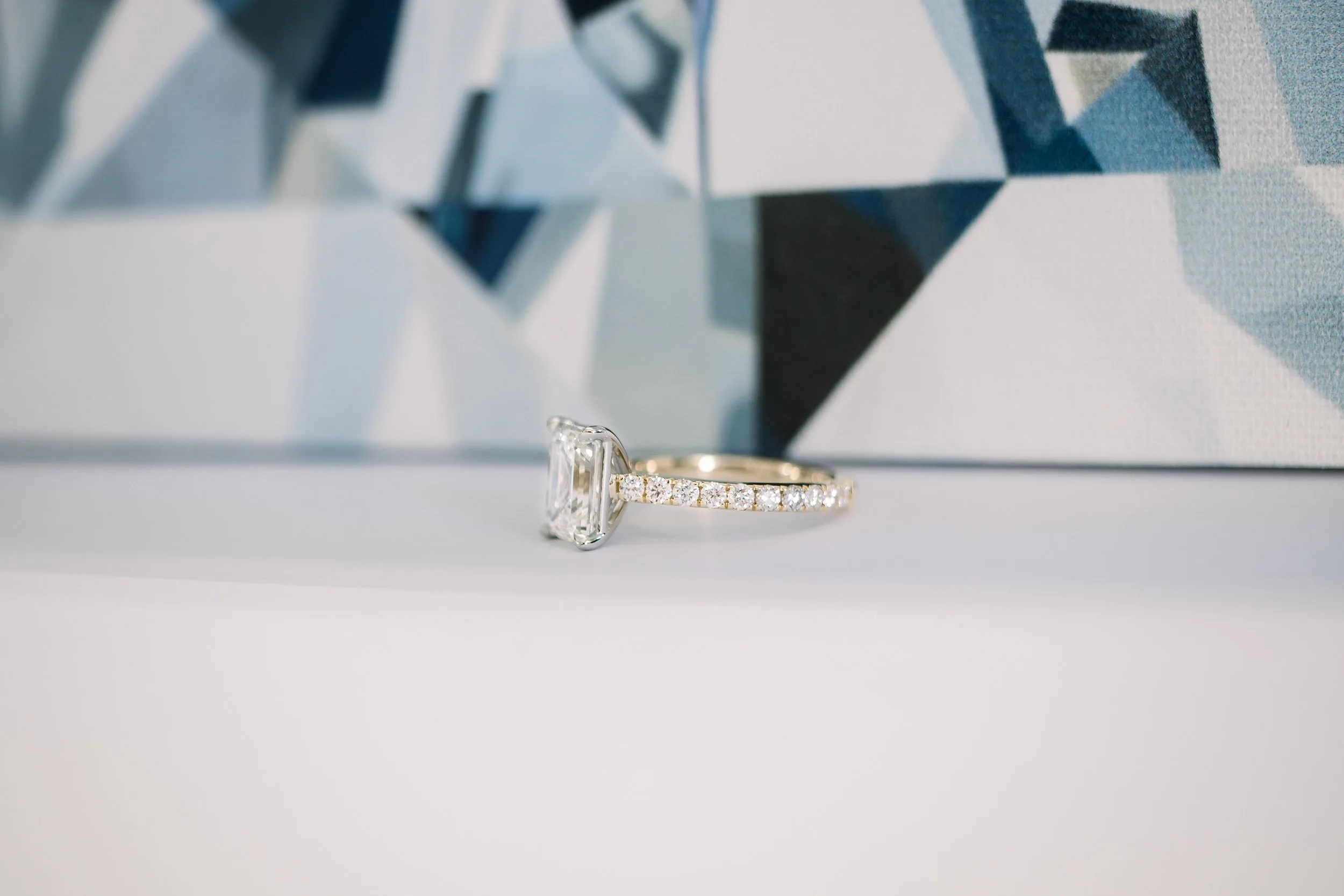 2.5ct emerald cut in cathedral pave setting