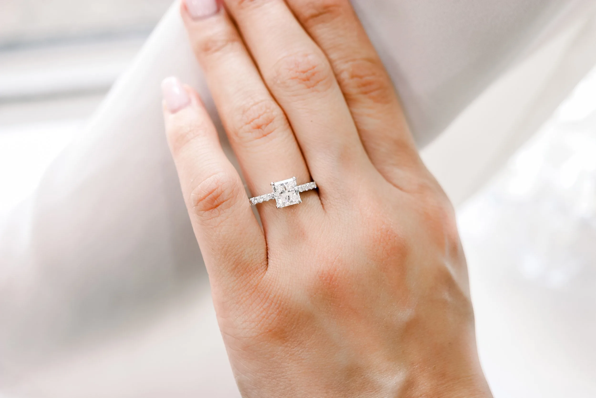 white gold pave engagement ring with princess cut lab grown diamond