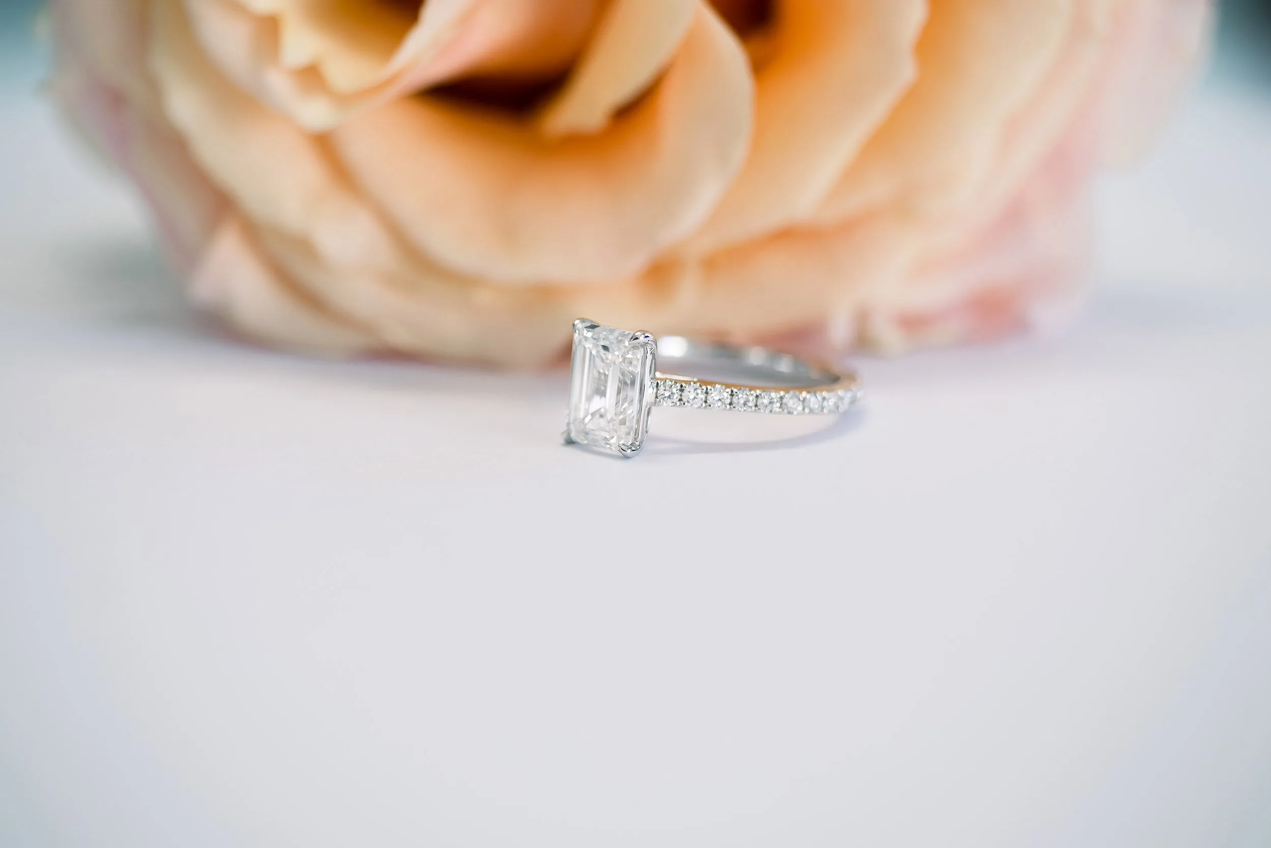 1.75ct emerald cut in cathedral pave setting