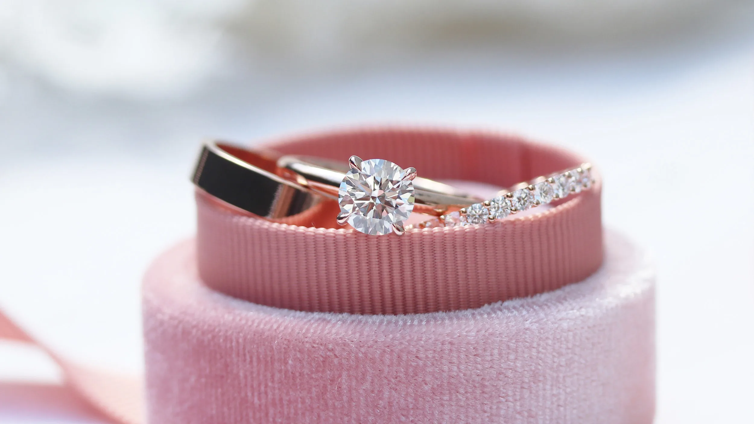 Round brilliant lab diamond engagement ring in rose gold with matching rose gold channel set lab diamond eternity band
