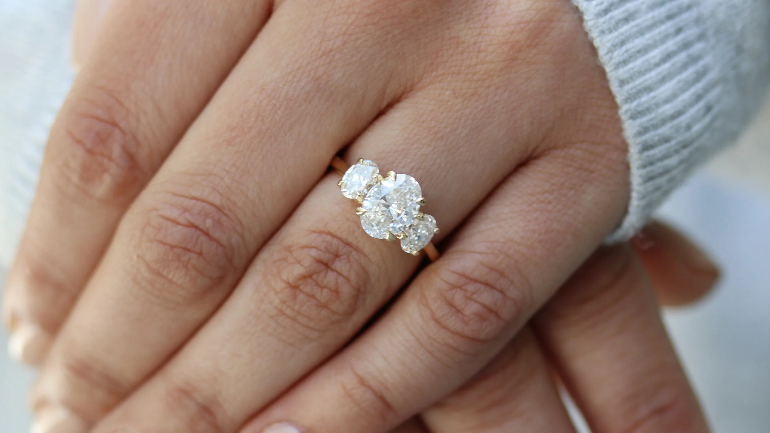 three stone oval lab grown diamond engagement ring