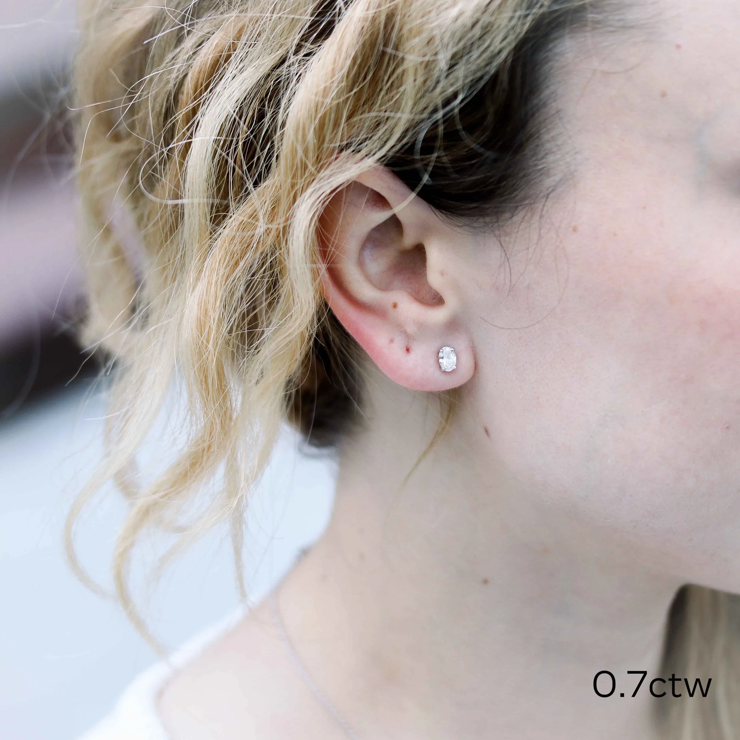 white gold oval lab diamond stud earrings on model ada diamonds design ad-287