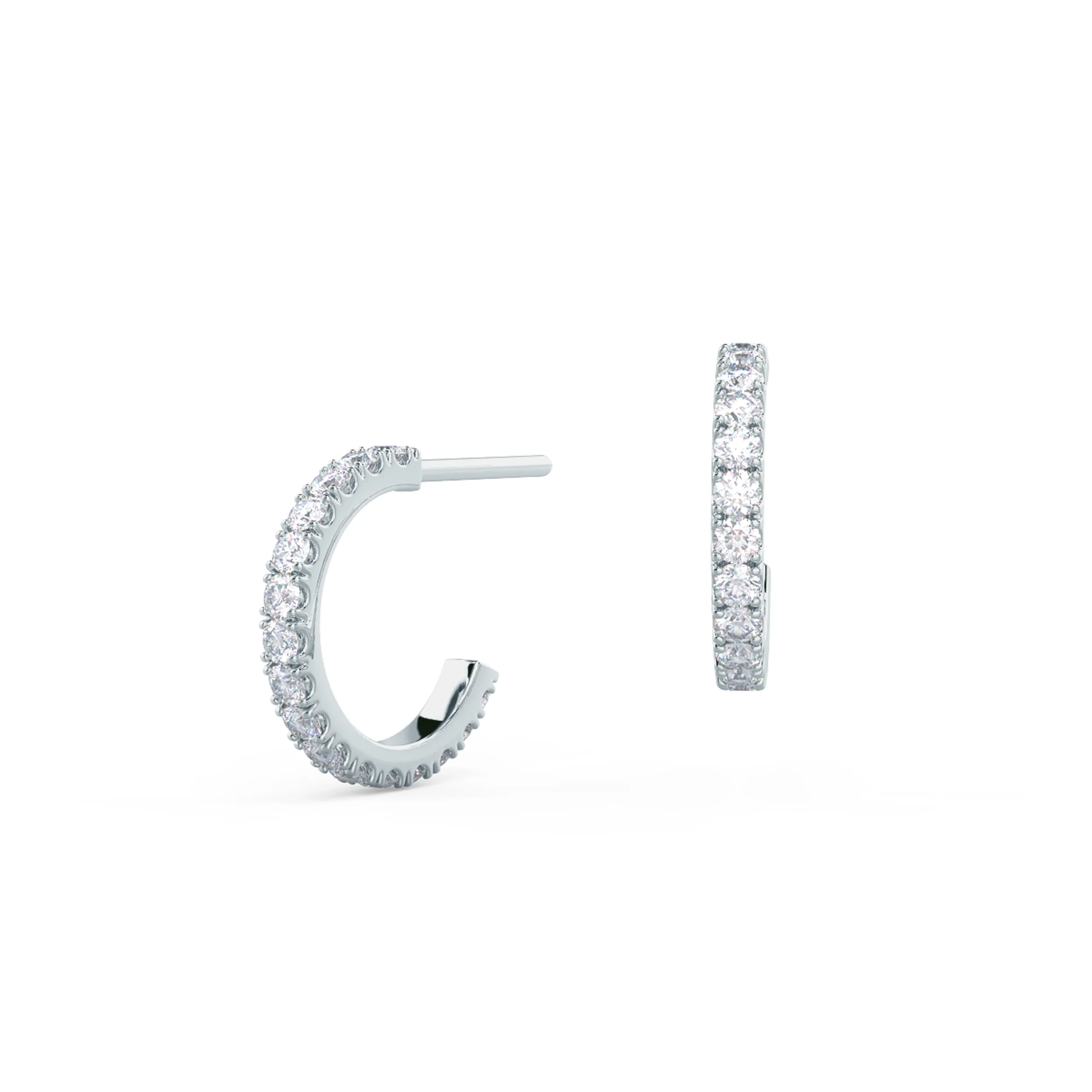 A pair of J-shaped huggie hoops featuring pave set lab created diamonds with a tension back in 14k White Gold.