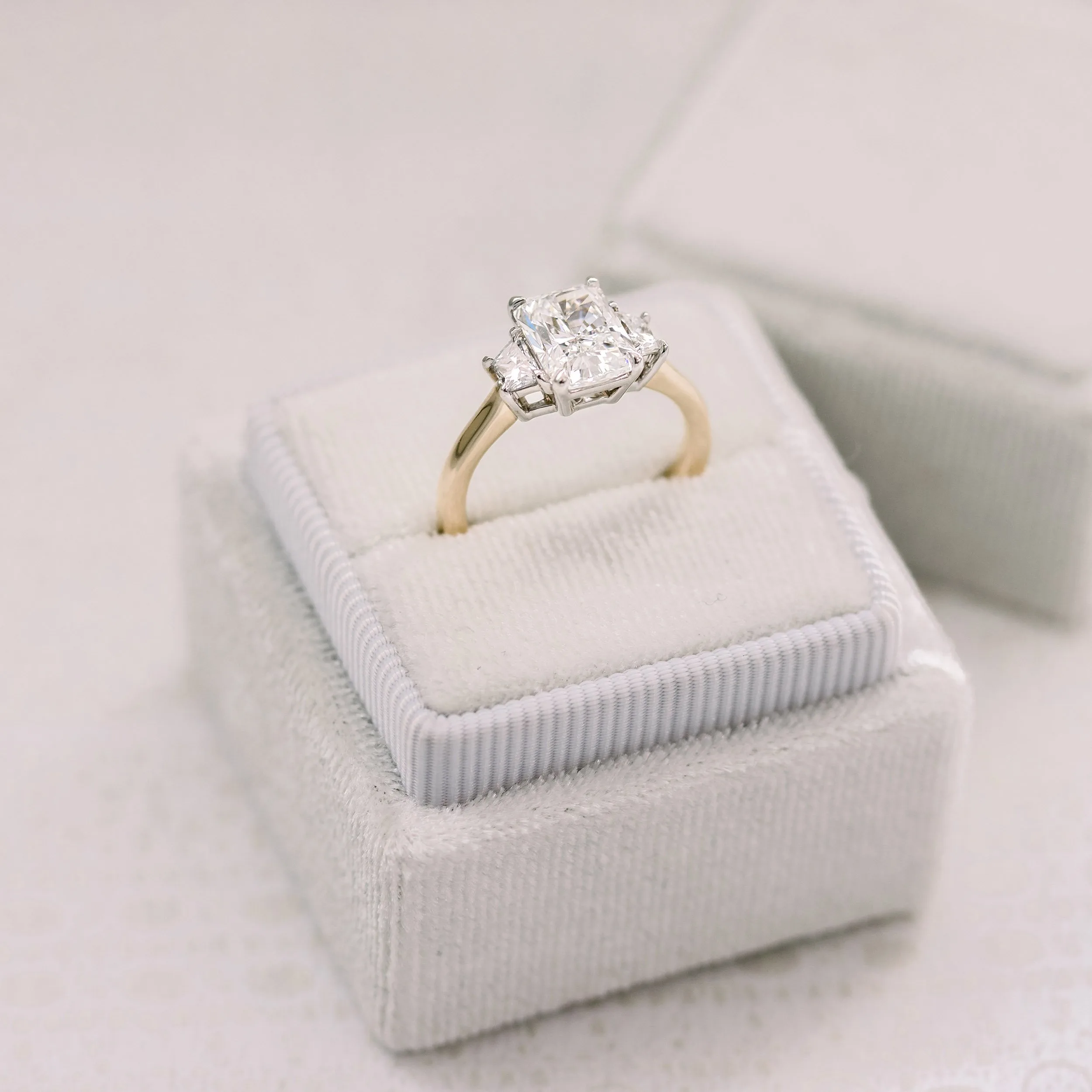 lab created three stone engagement ring