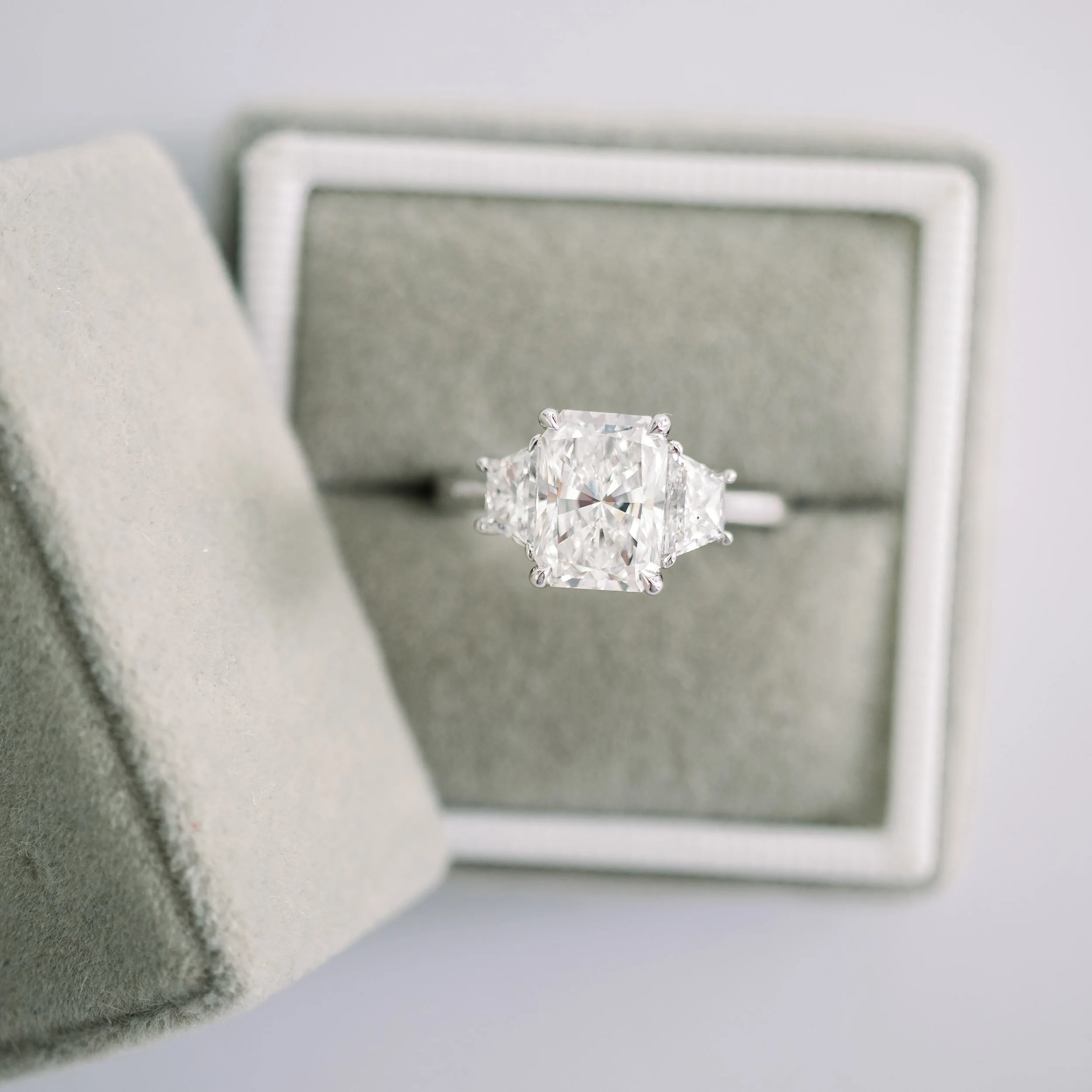 radiant and trapezoid three stone engagement ring