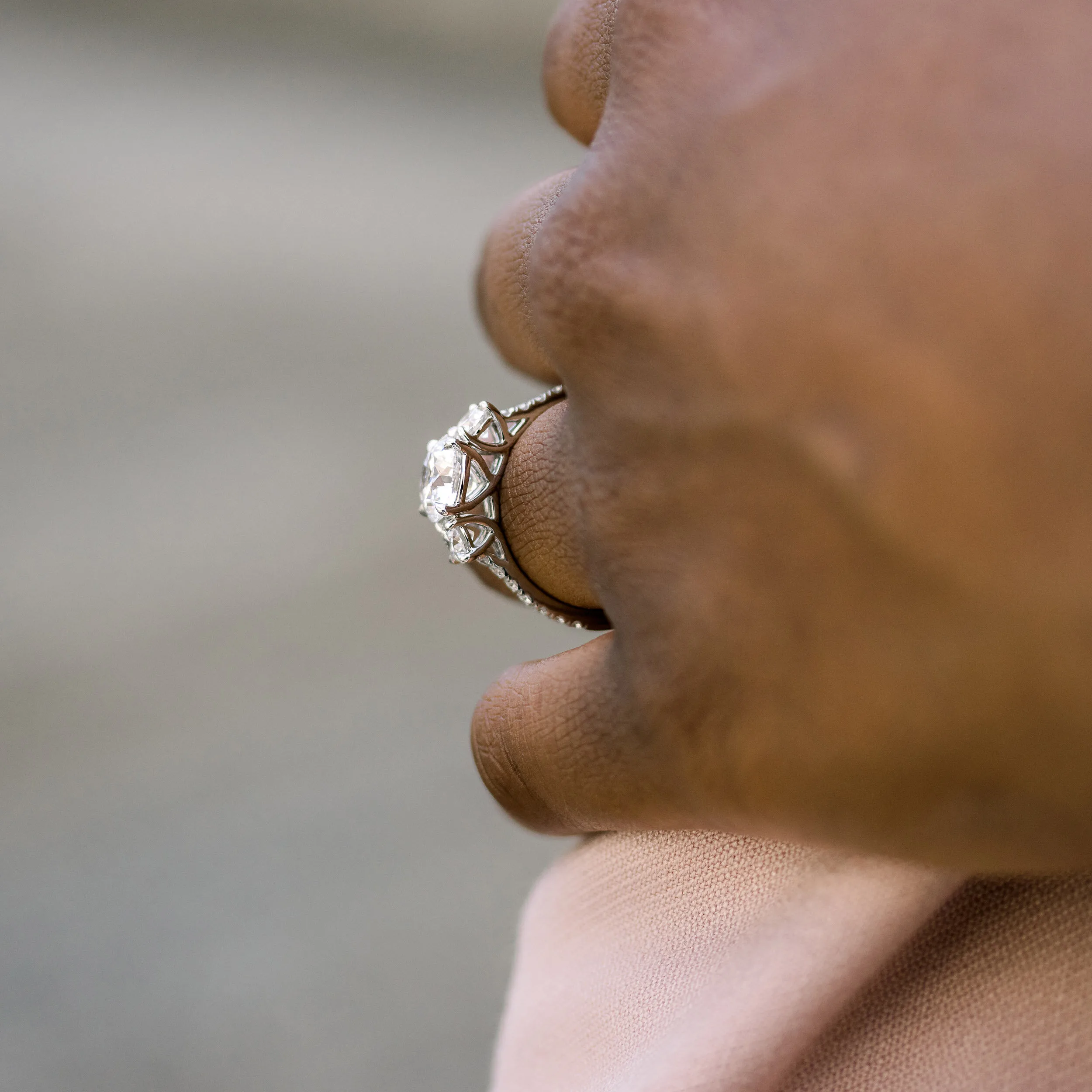 three stone lab diamond engagement ring with 2ct round center stone and diamond band in platinum