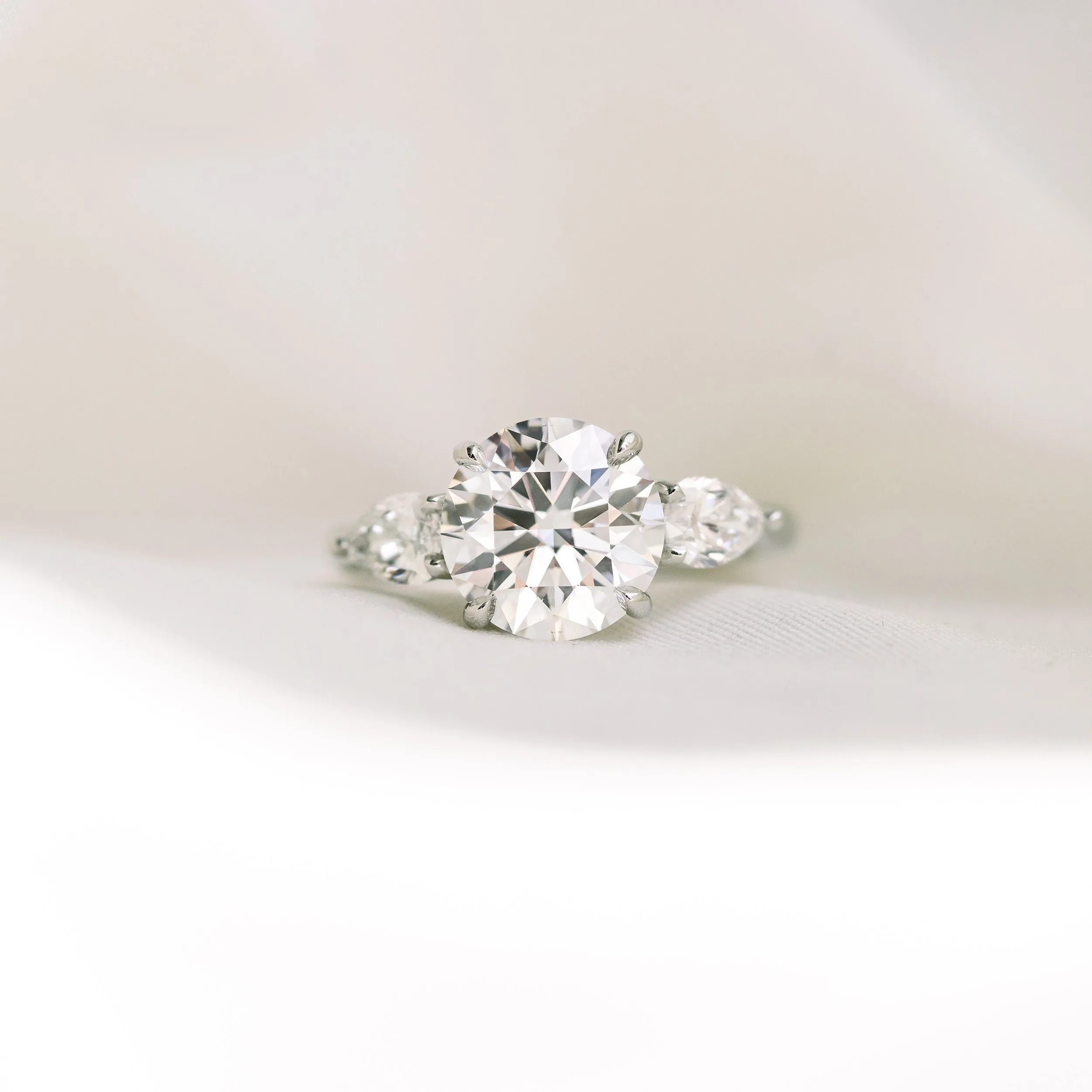 Two Carat Round Lab Diamond Engagement Ring with pear Side Stones Ada Diamonds Design AD-456