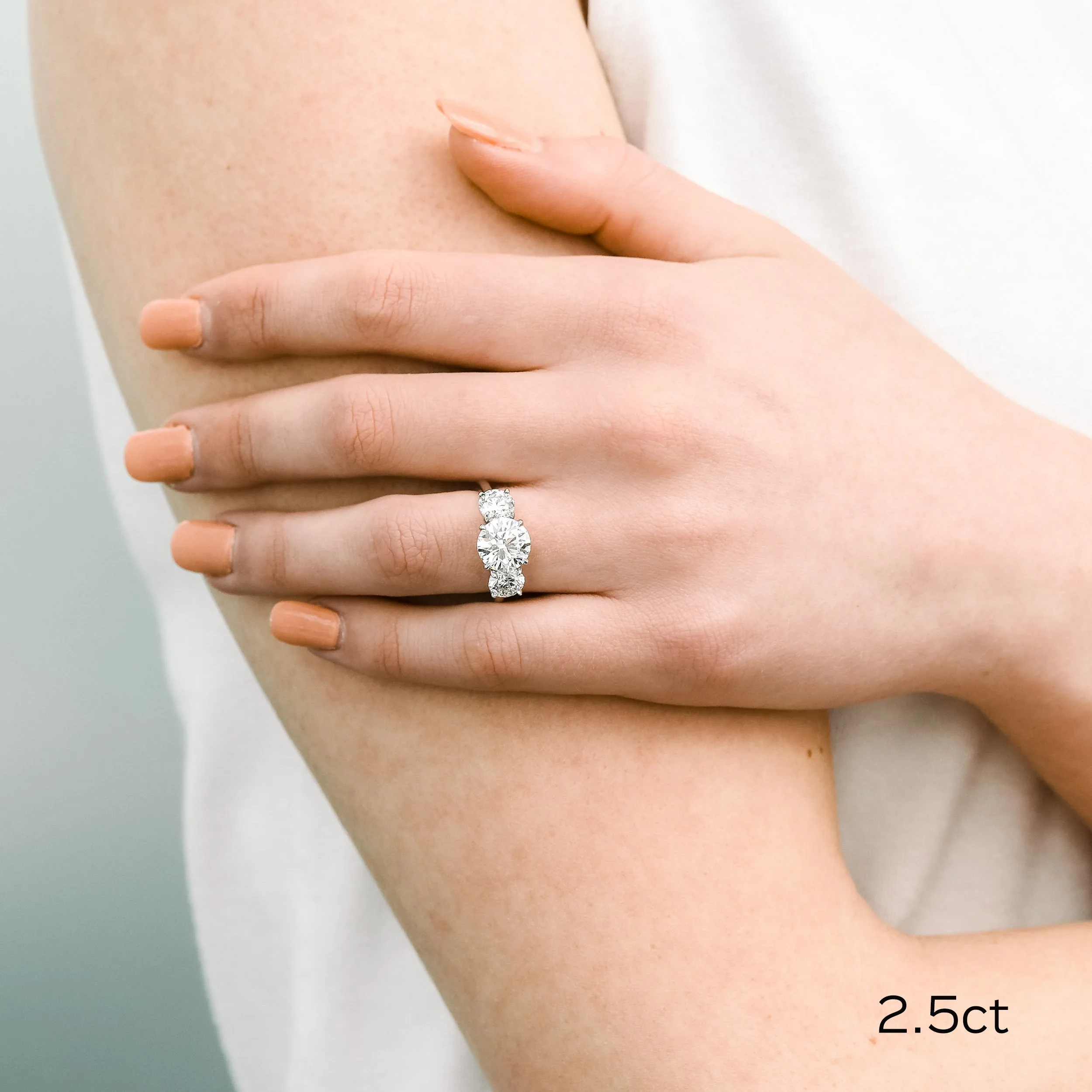 Platinum Three Stone Engagement Ring with 2.5 Carat Round Lab Diamond Ada Diamonds Design Number AD-070 on Model