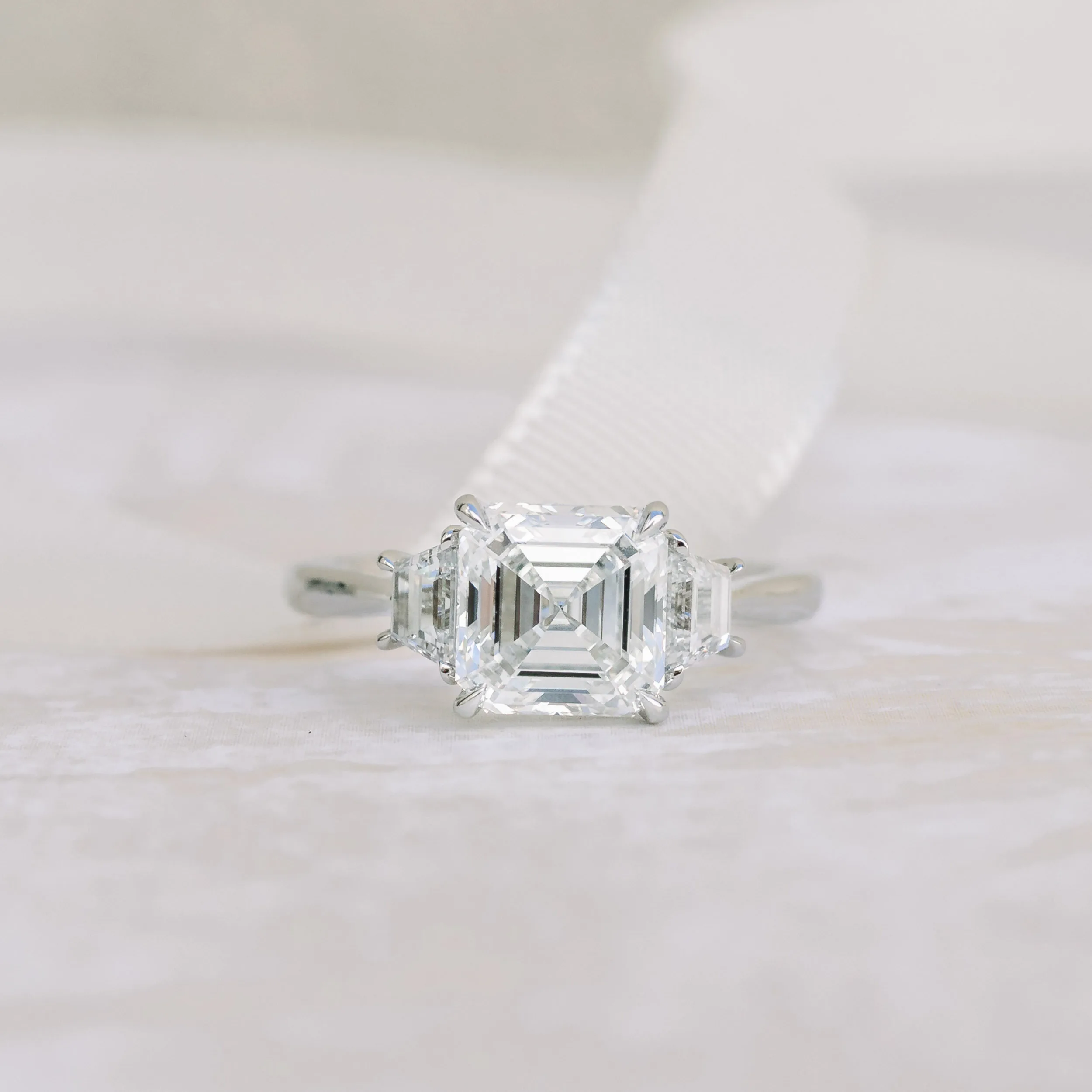 Platinum 2 Carat Asscher Cut Manmade Diamond Ring with Trapezoid Side Stones Ada Diamonds Design AD-494 Macro