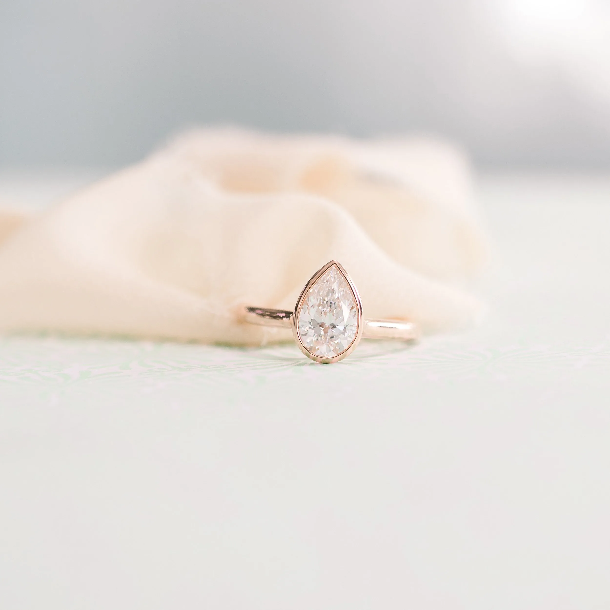 1.5ct pear cathederal bezel solitaire made in 18k rose gold engagement ring made with lab grown diamonds ADA Diamonds ad 148