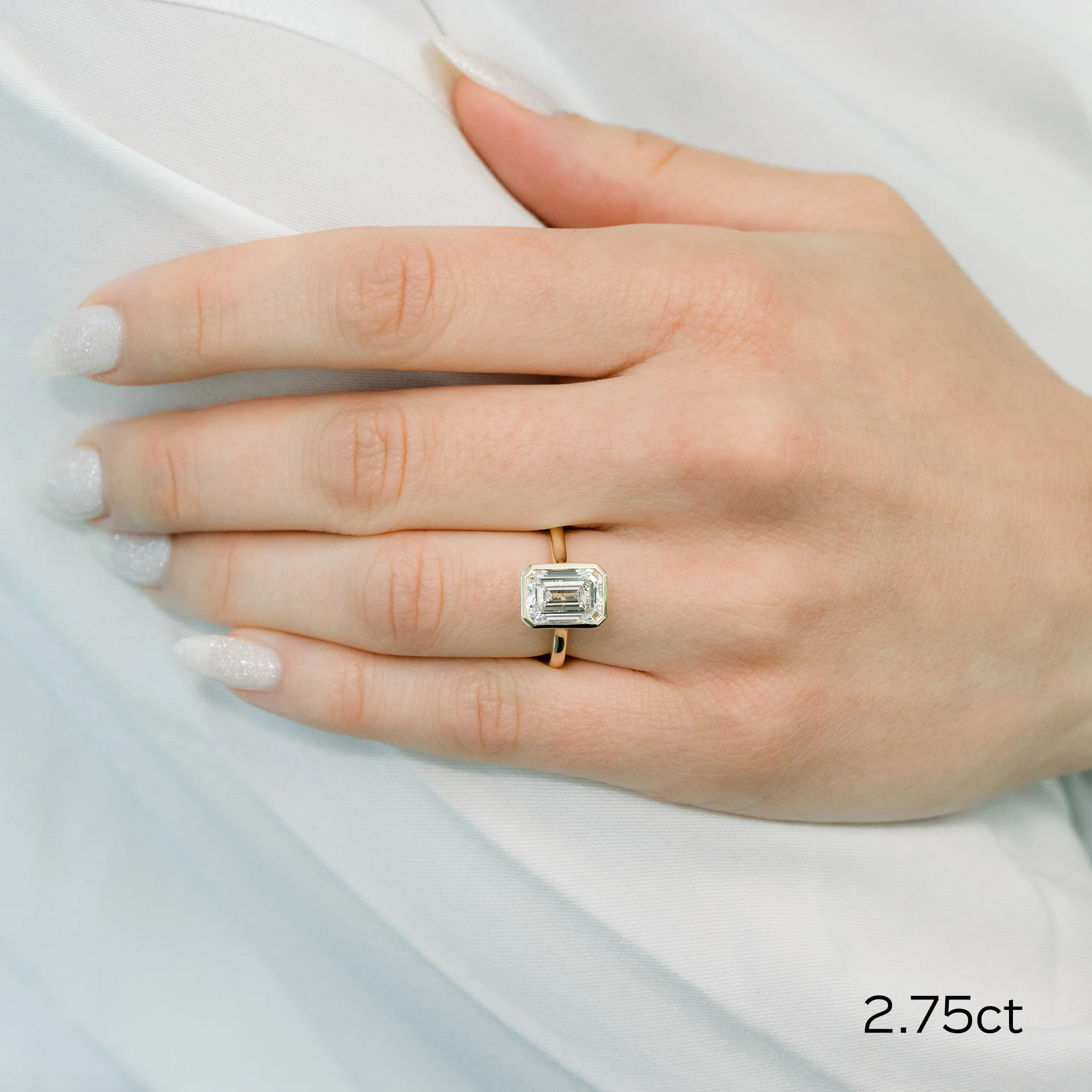 14k yellow gold 2.75ct emerald cut bezel set lab diamond solitaire engagement ring ada diamonds design ad 148 on model