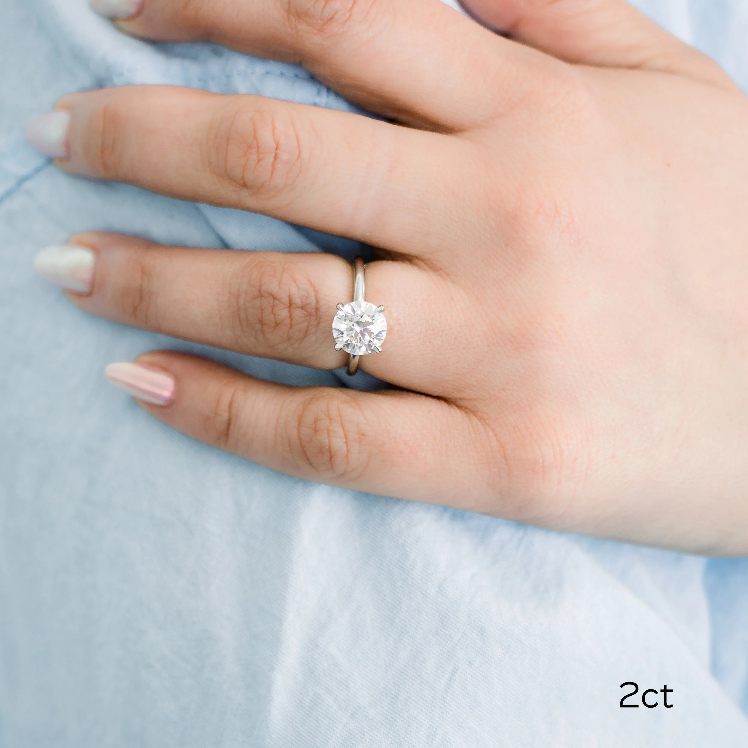 platinum 2 carat round classic four prong lab diamond solitaire engagement ring on model ada diamonds design ad 144