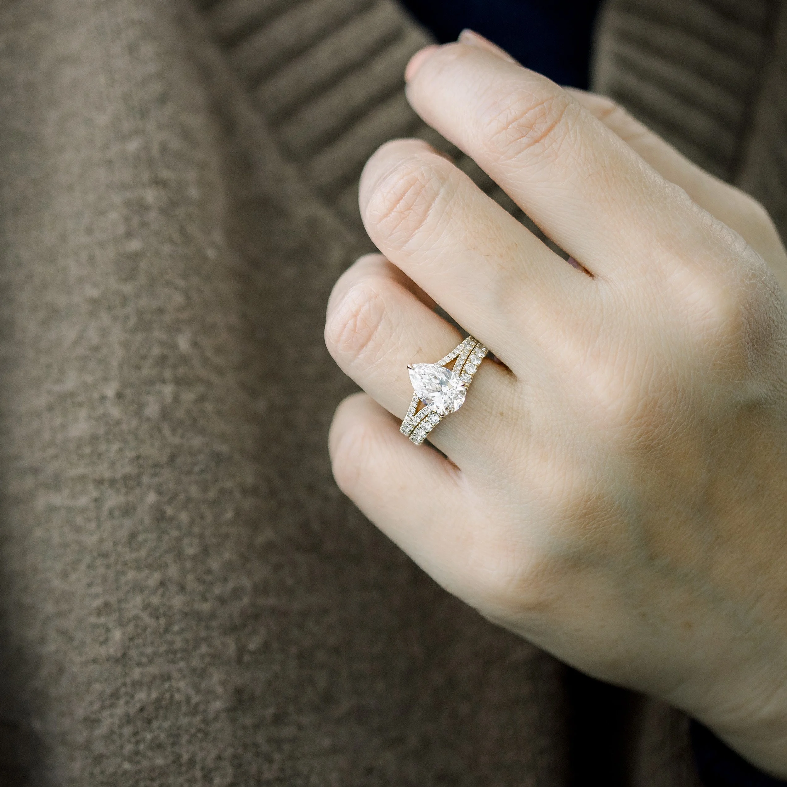 14k yellow gold pear trellis split shank lab diamond engagement ring with custom nesting wedding band ada diamonds design ad 153 and ad 262 on model