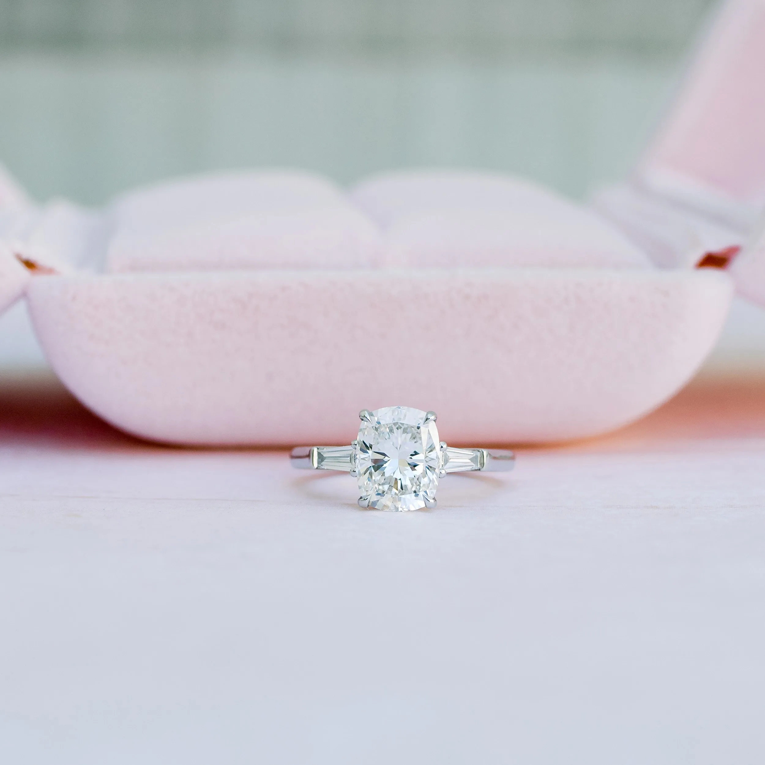 platinum 2.5 ct cushion and baguette three stone lab diamond ring in pink box ada diamonds design ad 471