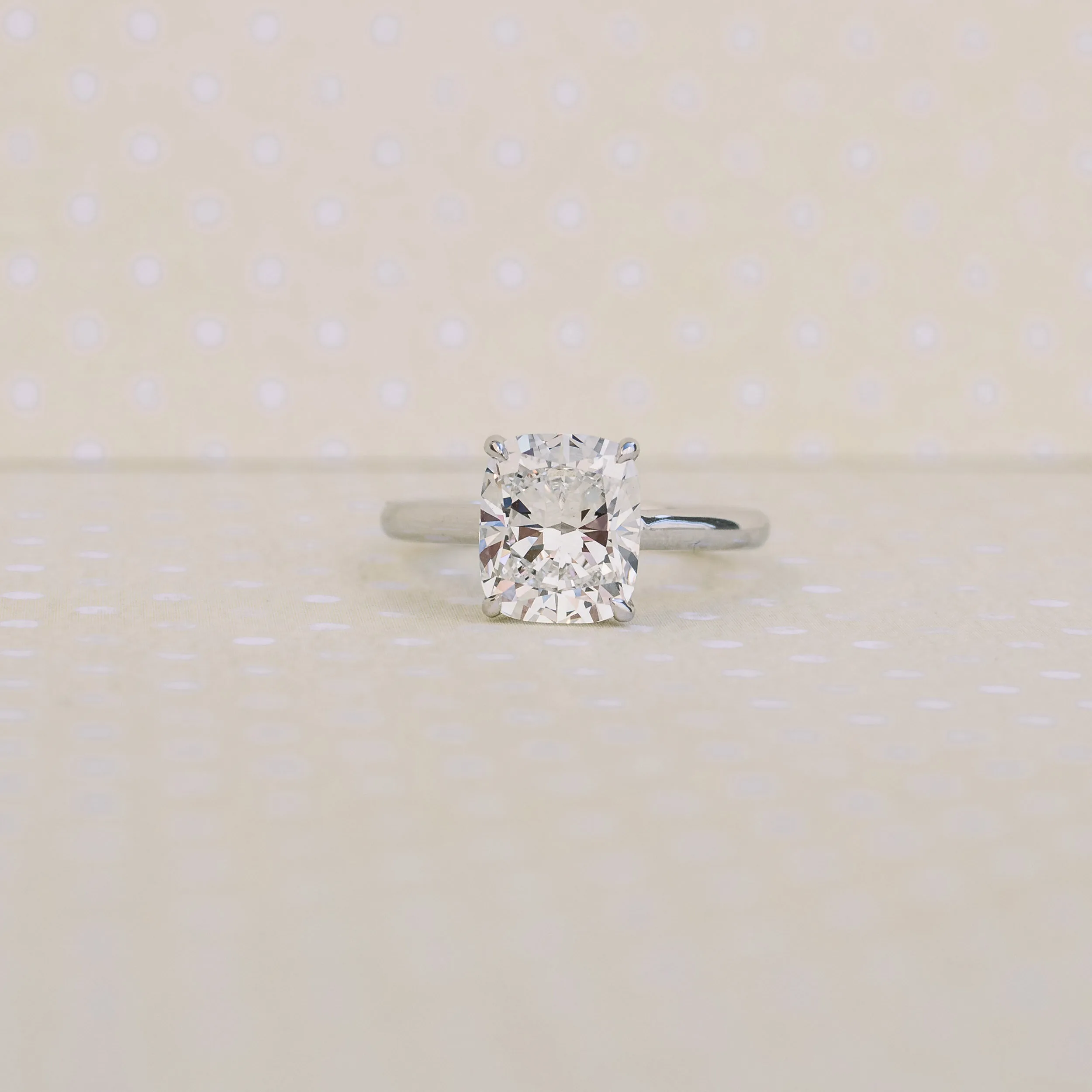 white gold cathedral solitaire with cushion cut