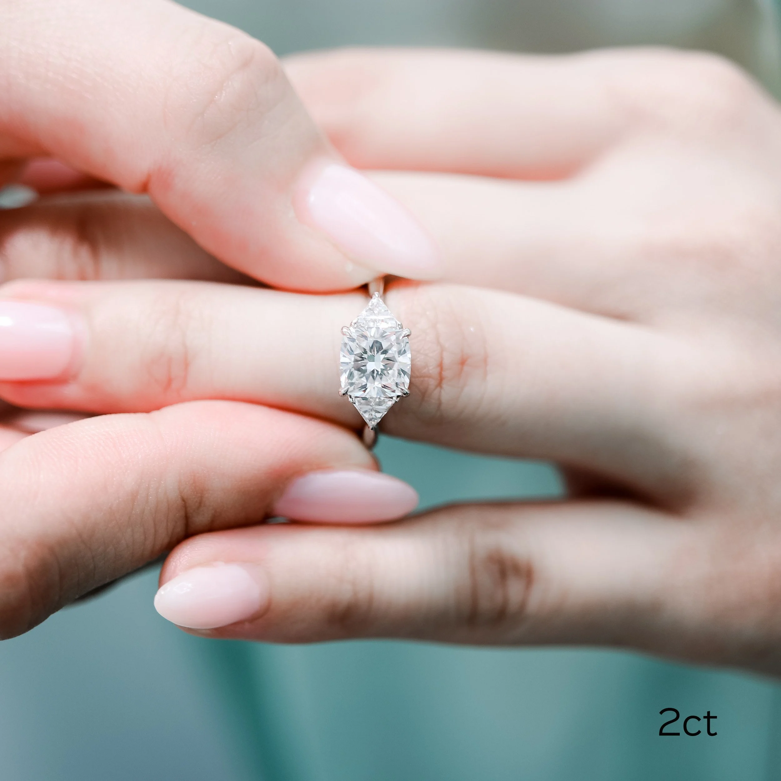 platinum 2 carat three stone lab diamond engagement ring featuring cushion cut and trillion side stones ada diamonds design ad 472