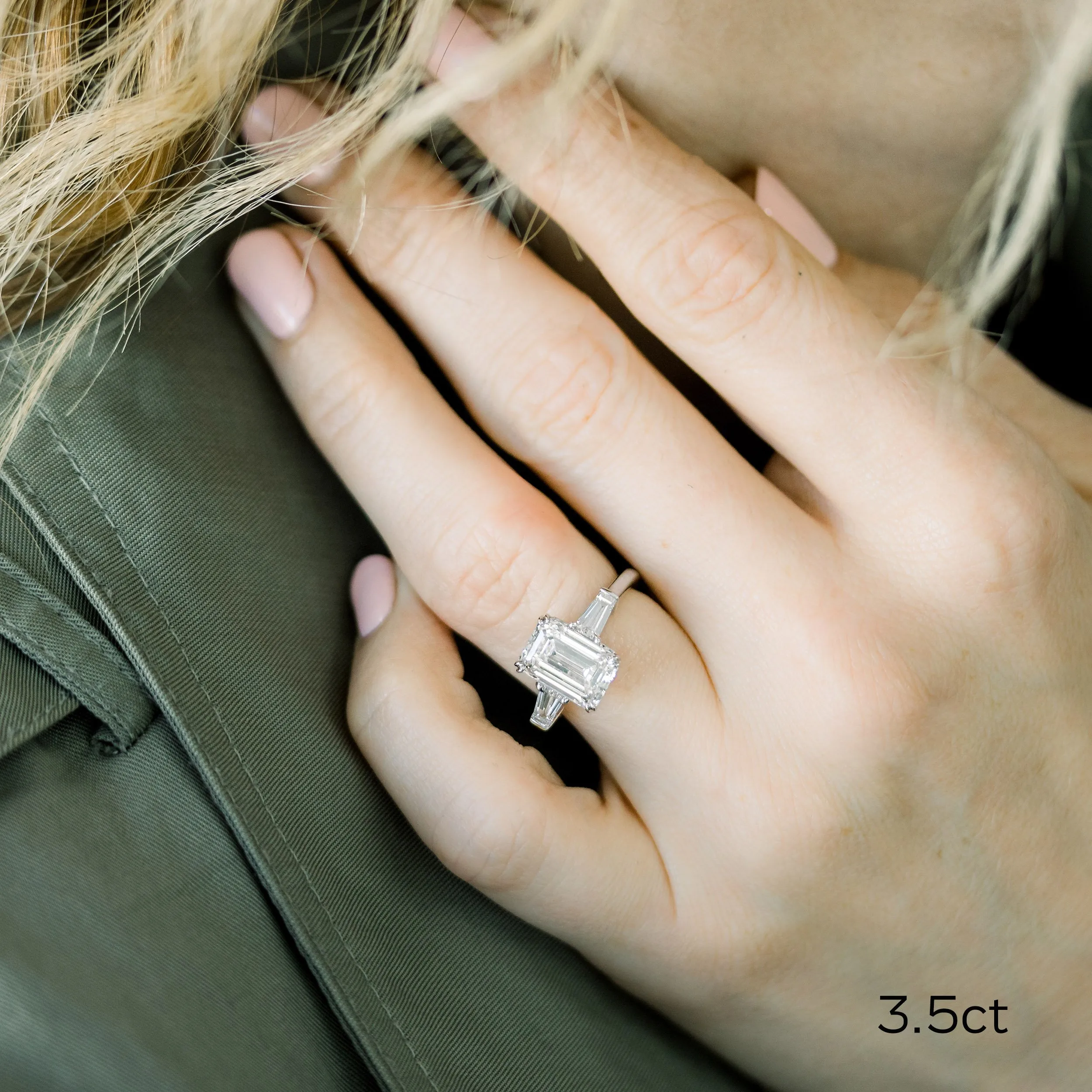 platinum four carat emerald cut and baguette three stone lab created diamond engagement ring on model ada diamonds design ad 464 d