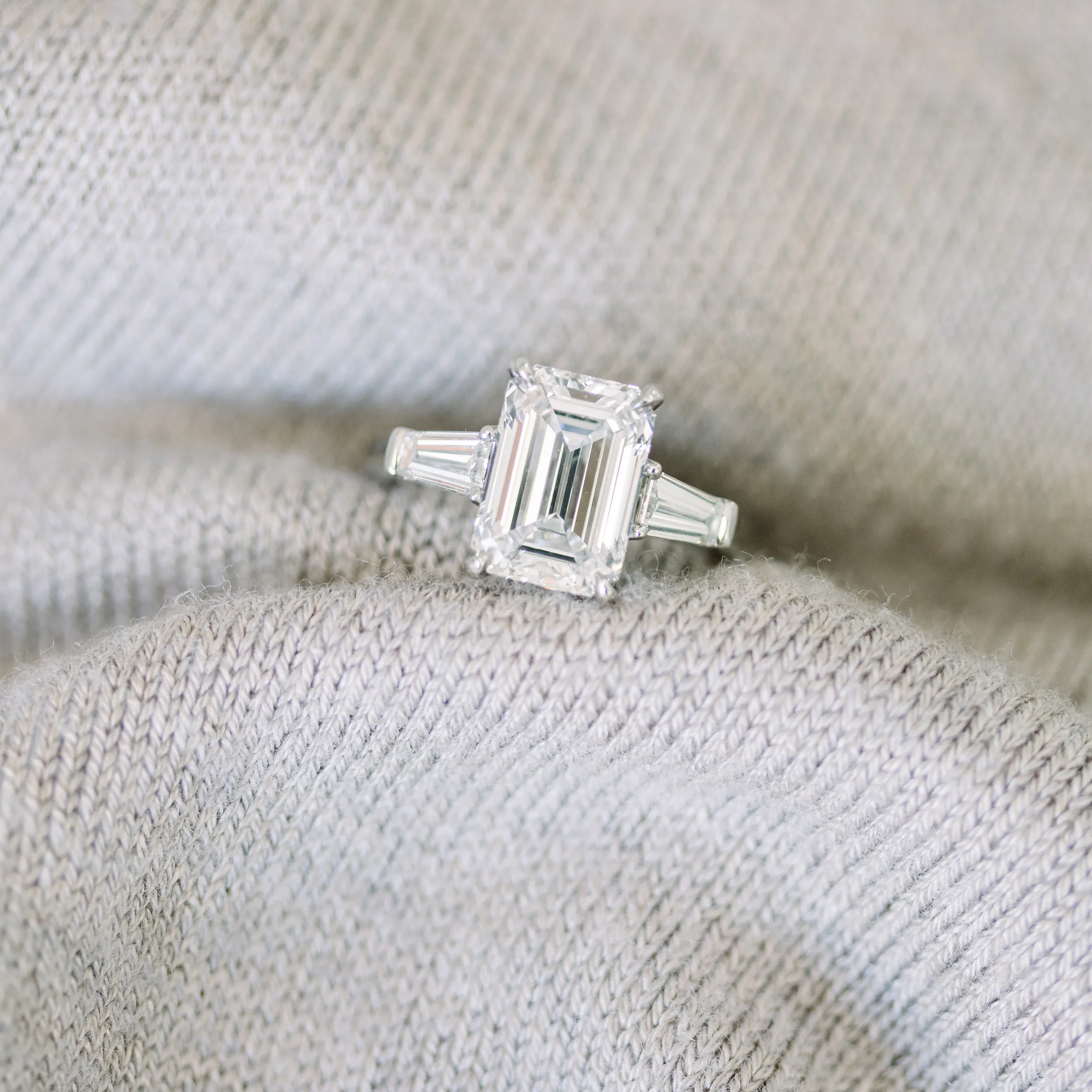 emerald cut lab diamond with baguette side stones in platinum ring