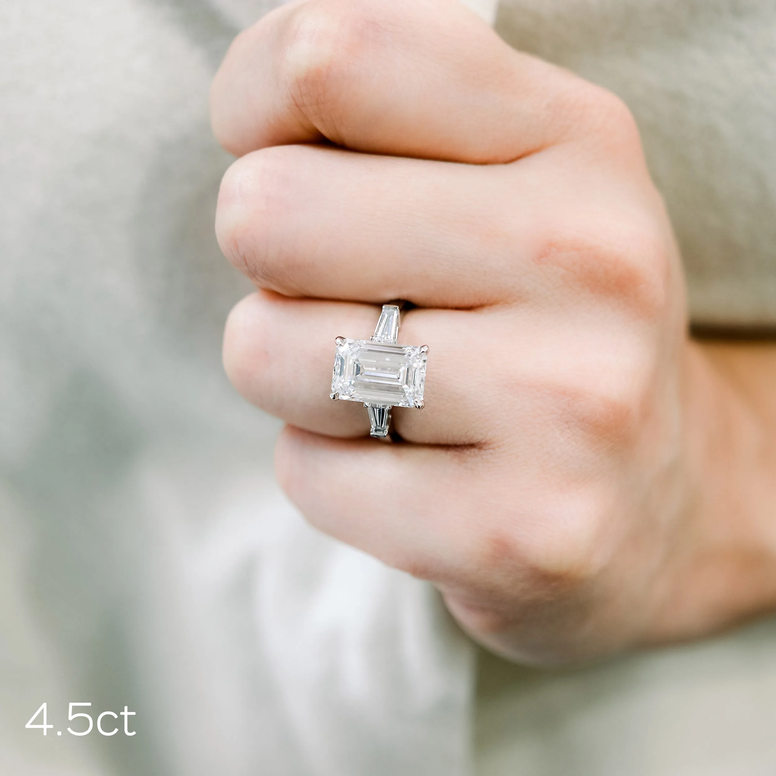 4.5ct emerald cut lab diamond in a three stone setting with tapered baguettes in platinum
