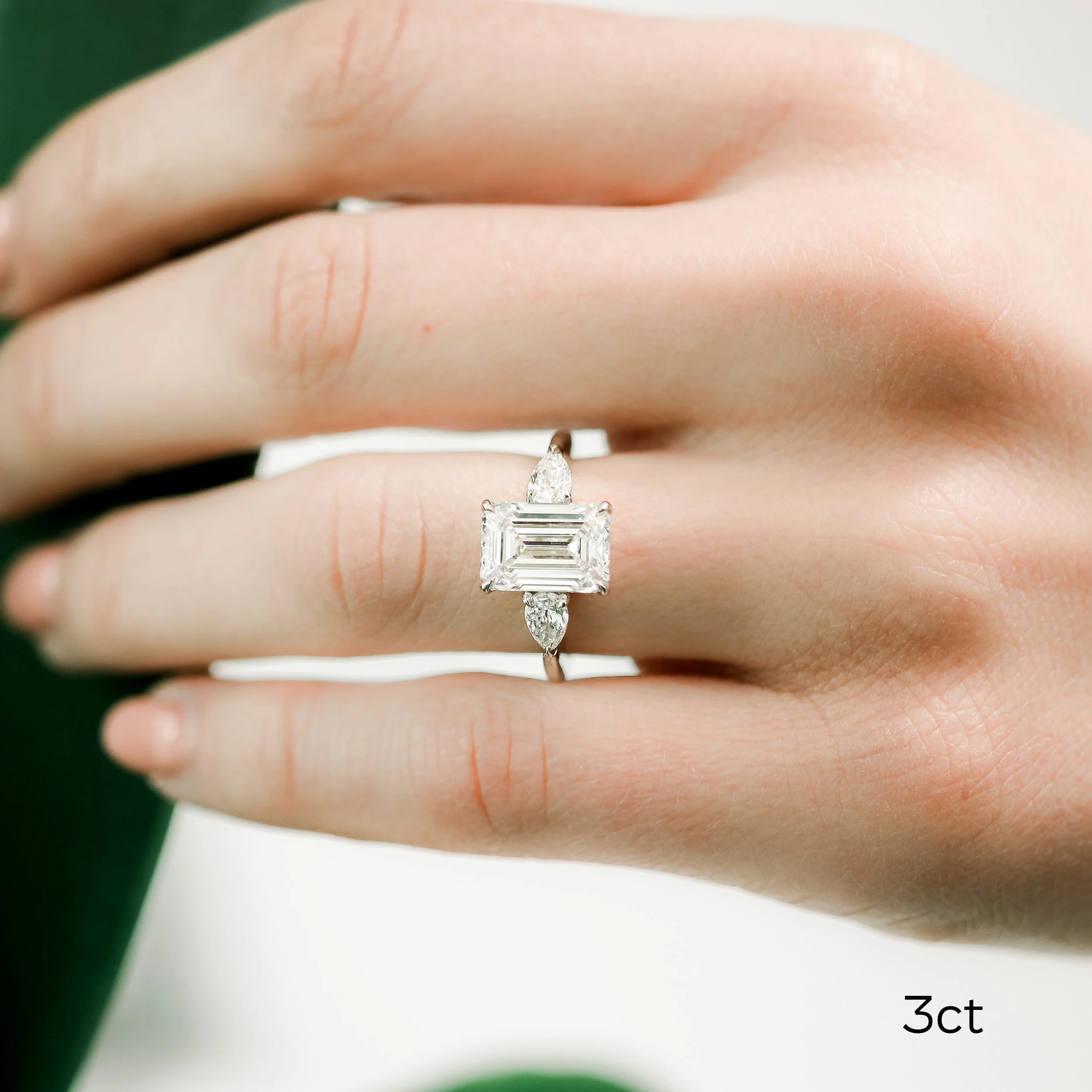 platinum 3.5 carat emerald and pear lab created diamond engagement ring ada diamonds design ad 467 on model
