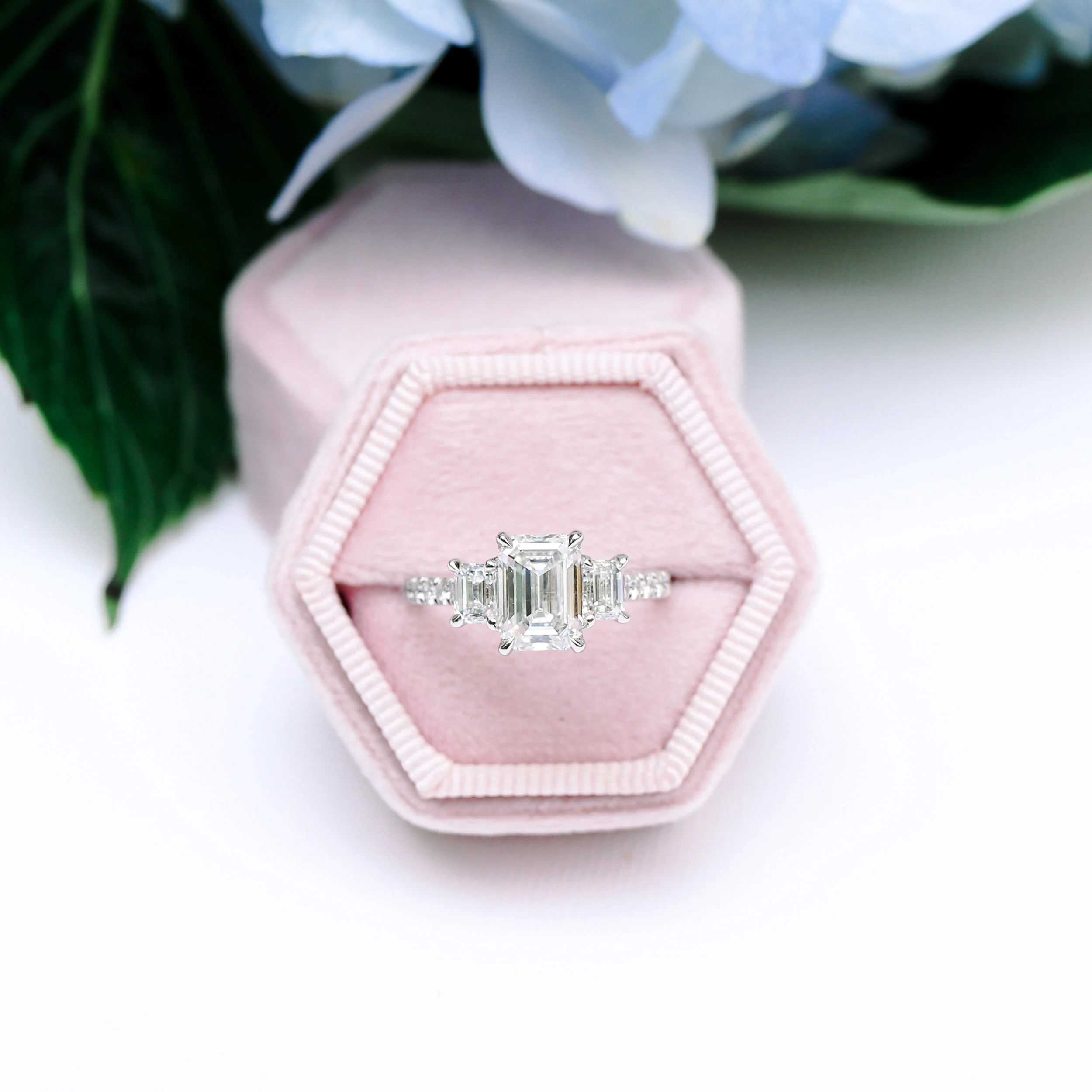 custom three stone emerald pave wedding ring with a 3ct emerald lab grown diamond