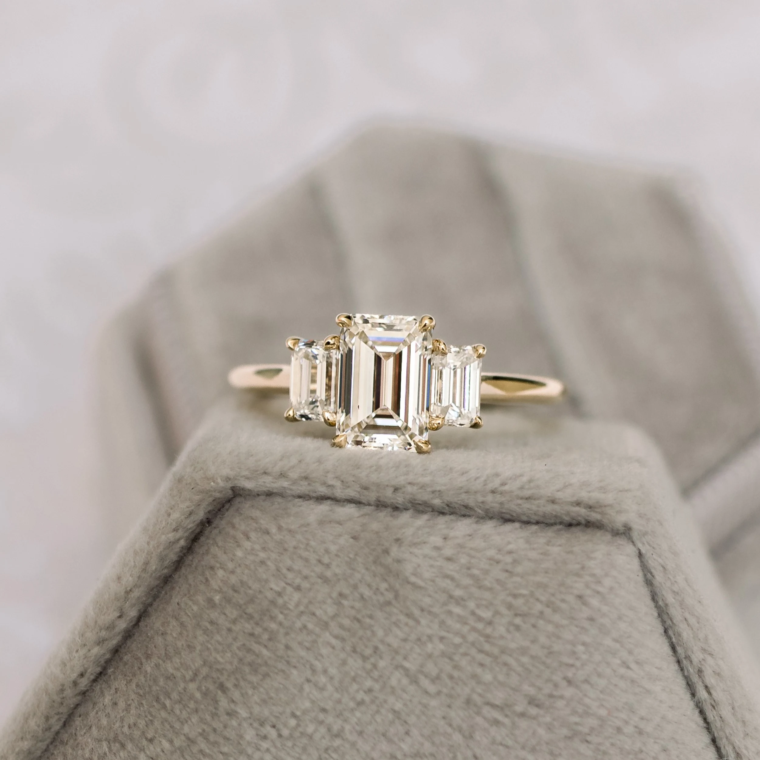 yellow gold three stone emerald cut lab diamond engagement ring ada diamonds design ad 114 on model