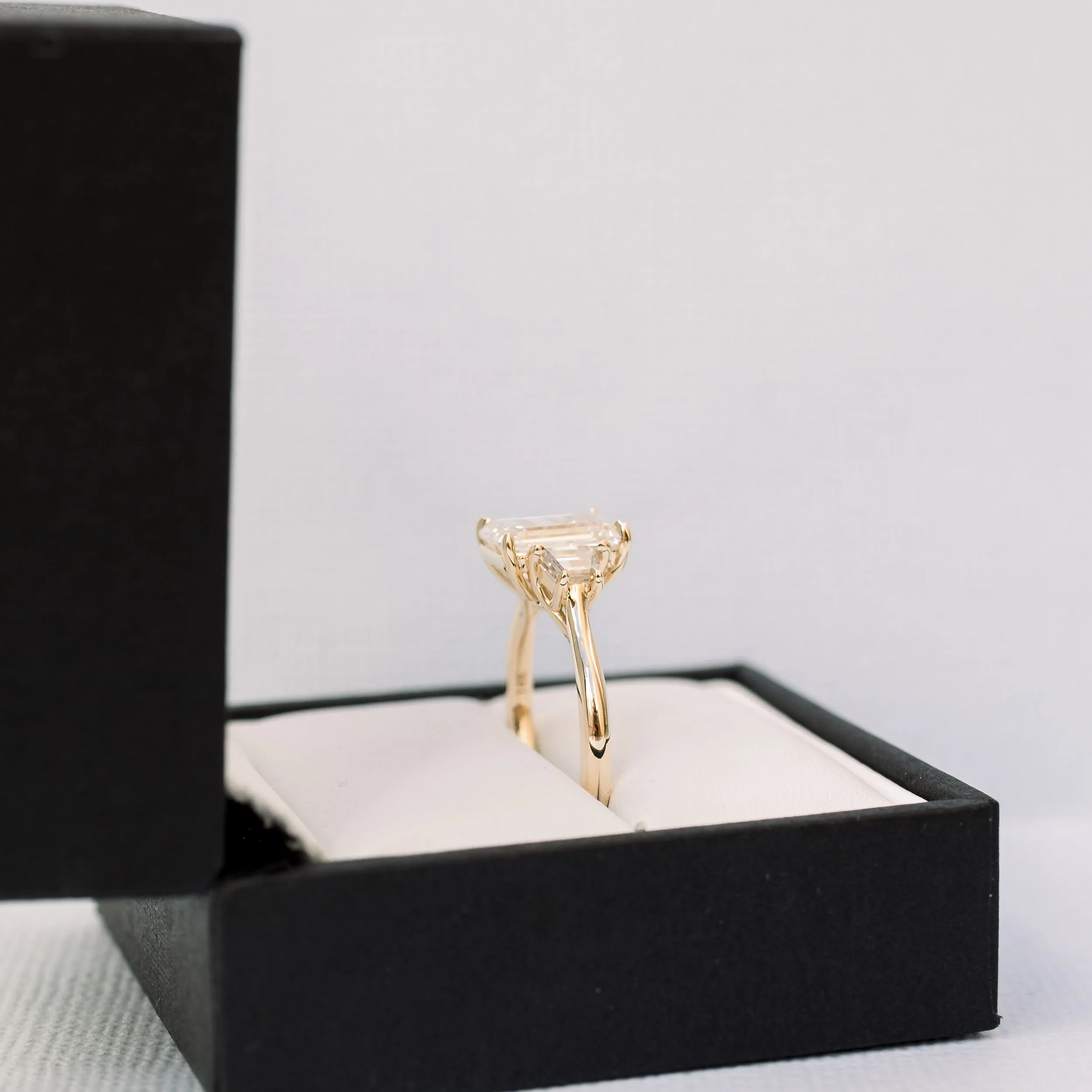 14k yellow gold 3 ct emerald cut lab created diamond and trapezoid three stone engagement ring ada diamonds design ad 465 profile