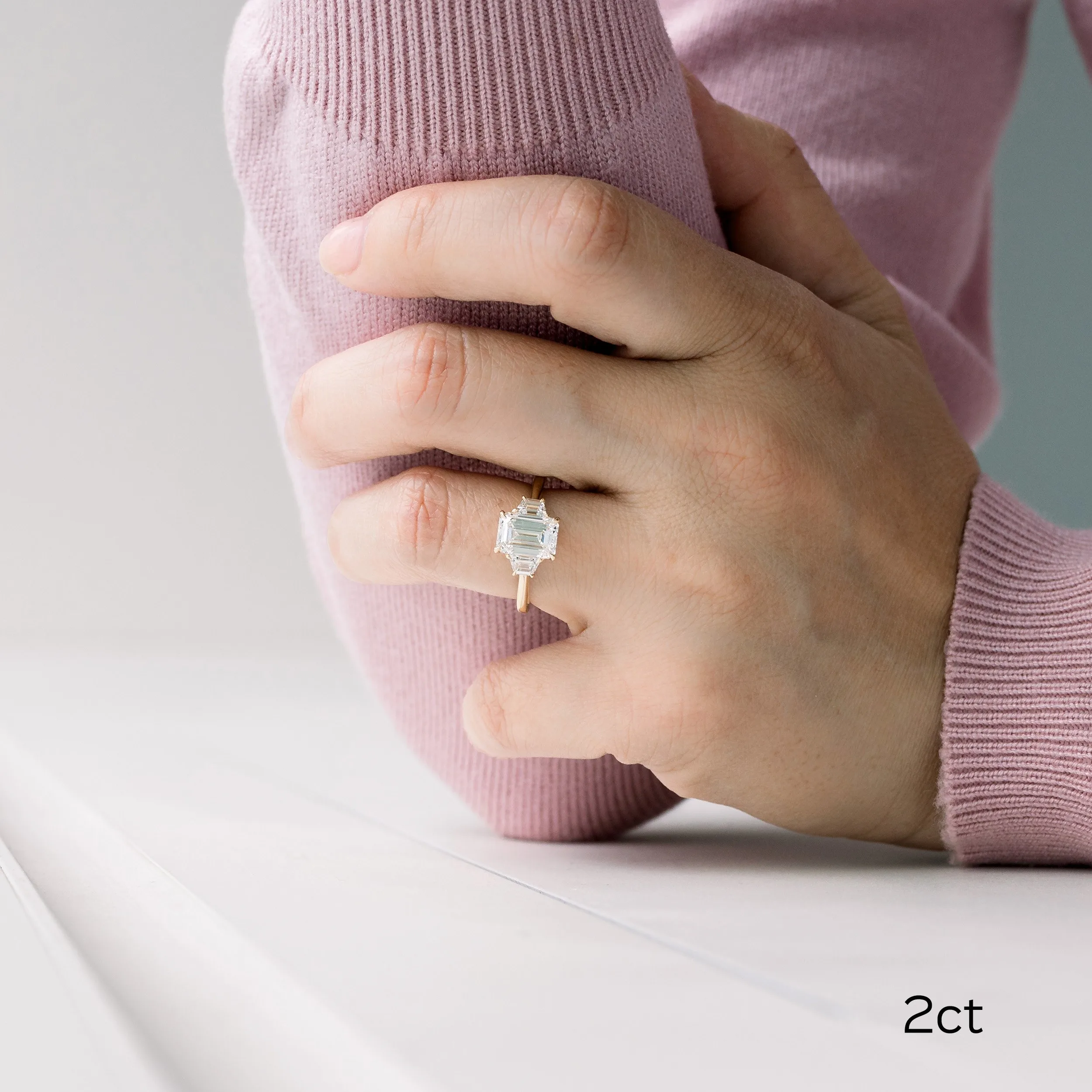18k yellow gold 2.5 carat emerald cut and trapezoid three stone lab diamond engagement ring ada diamonds design ad 465 on model