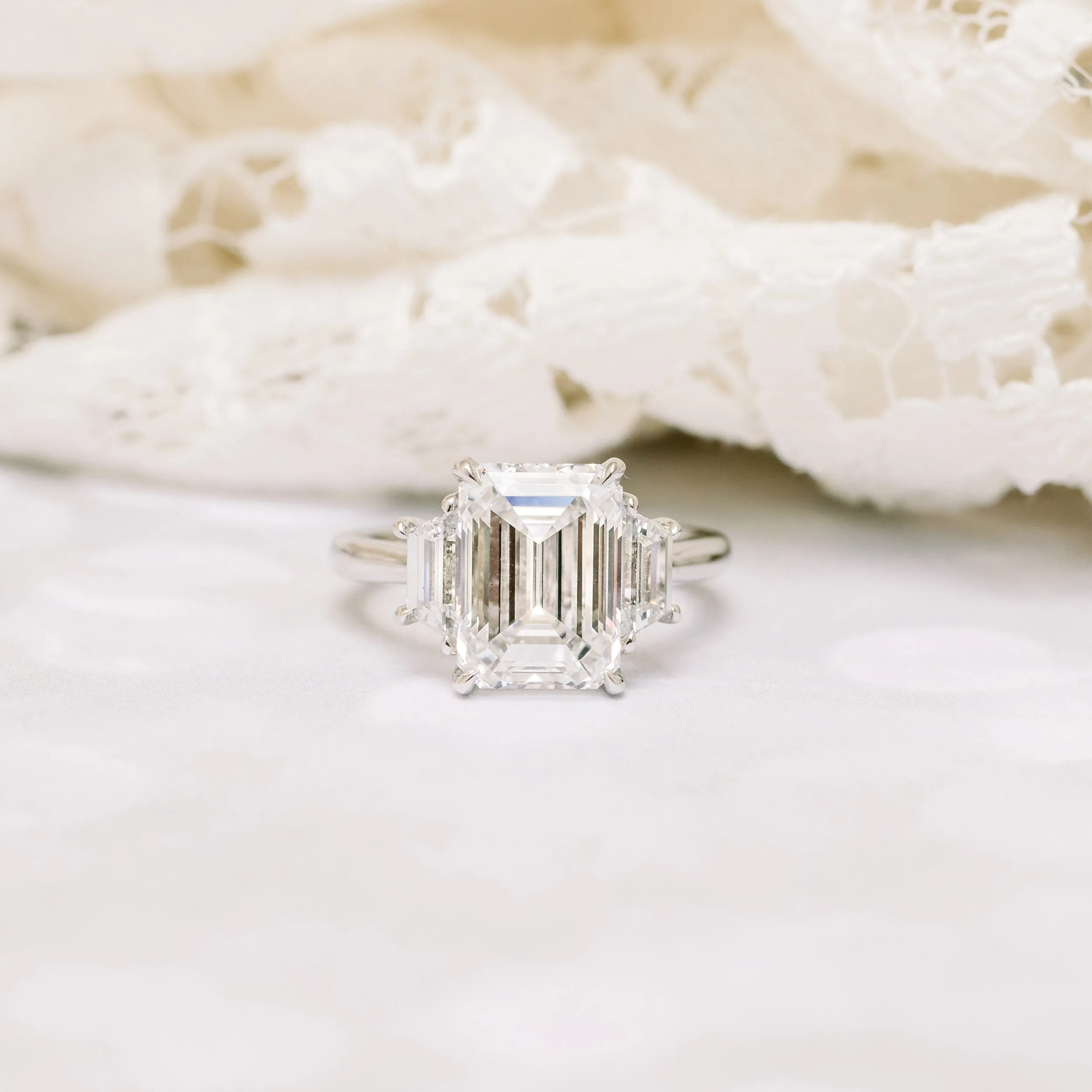 engagement ring with 3 carat lab grown emerald cut diamond and trapezoid side stones